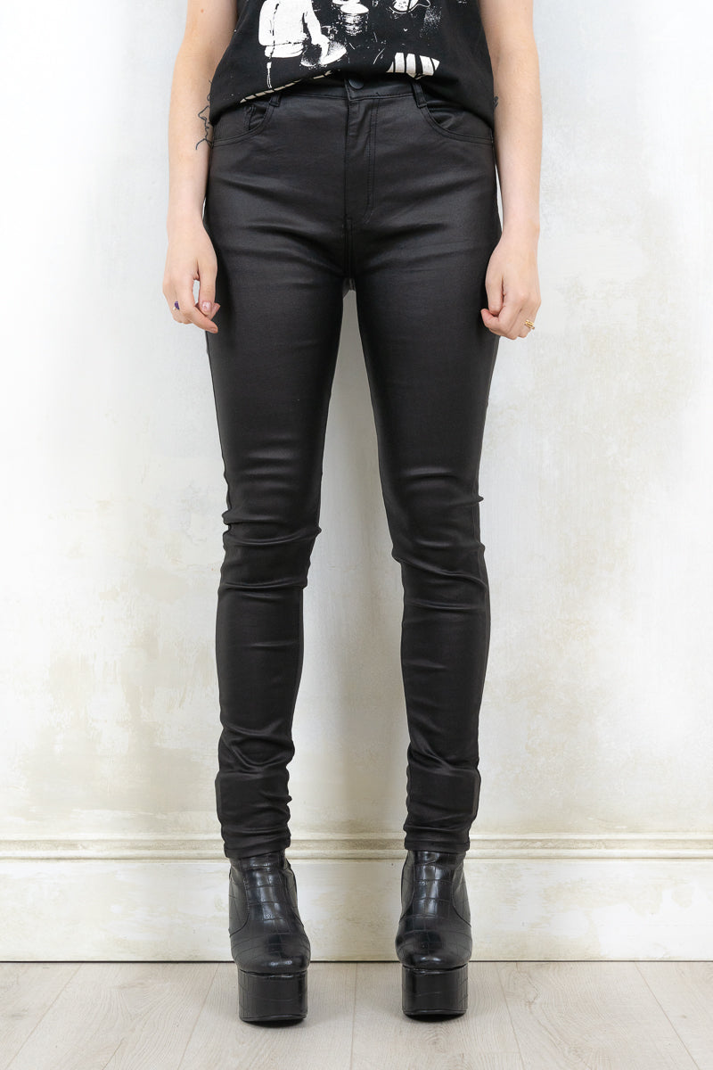 Model Wearing Edge of Darkness Skinnies - Black Skinnies with Front button and zip closure with true pockets