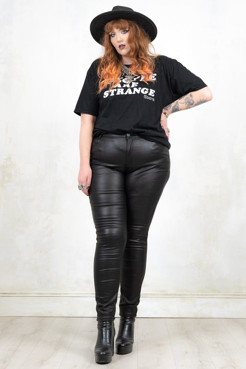 Model Wearing Edge of Darkness Skinnies - Black Skinnies with Front button and zip closure with true pockets