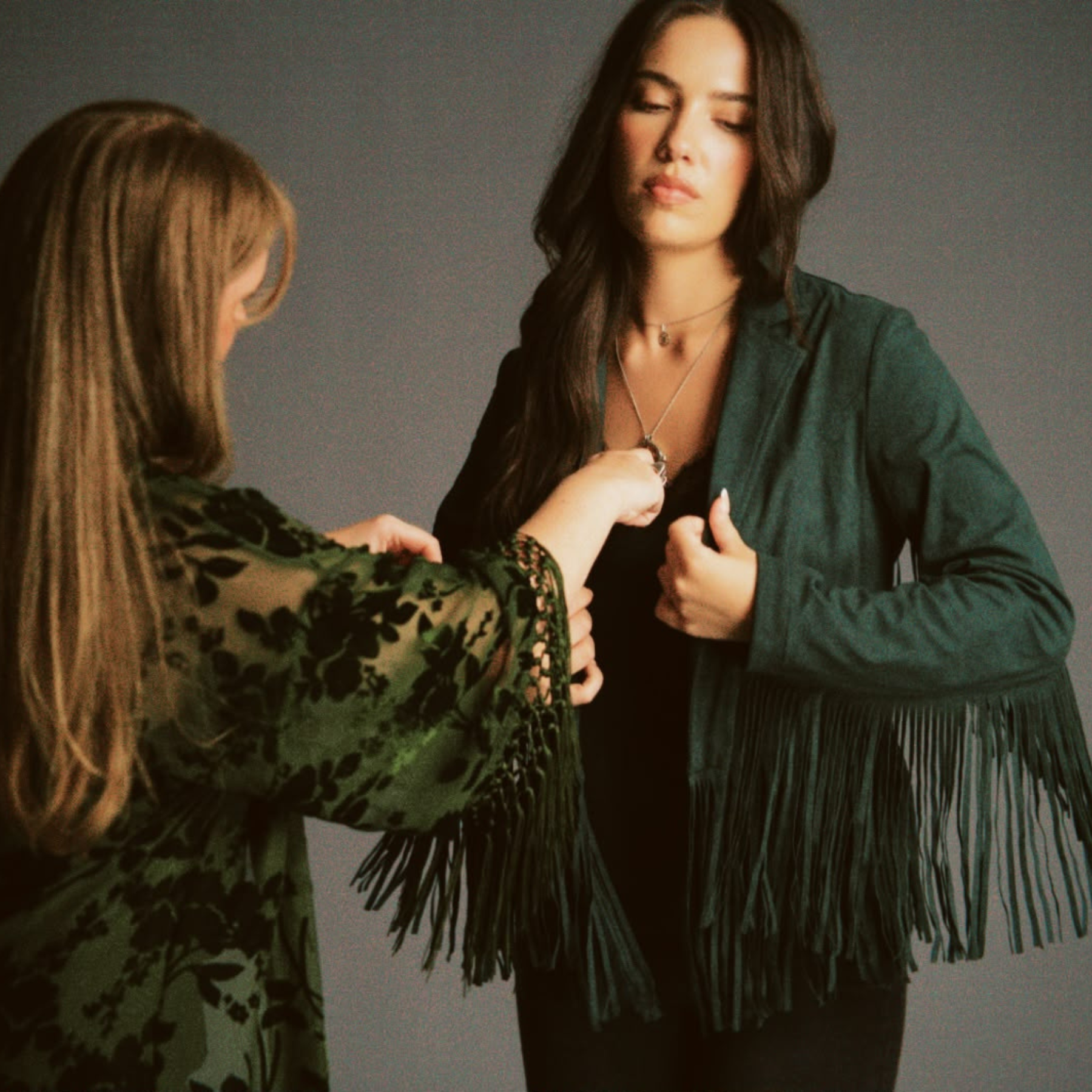 Jade and Model, Jessica fitting the Ivy Fringed Faux Suede Jacket on set.
