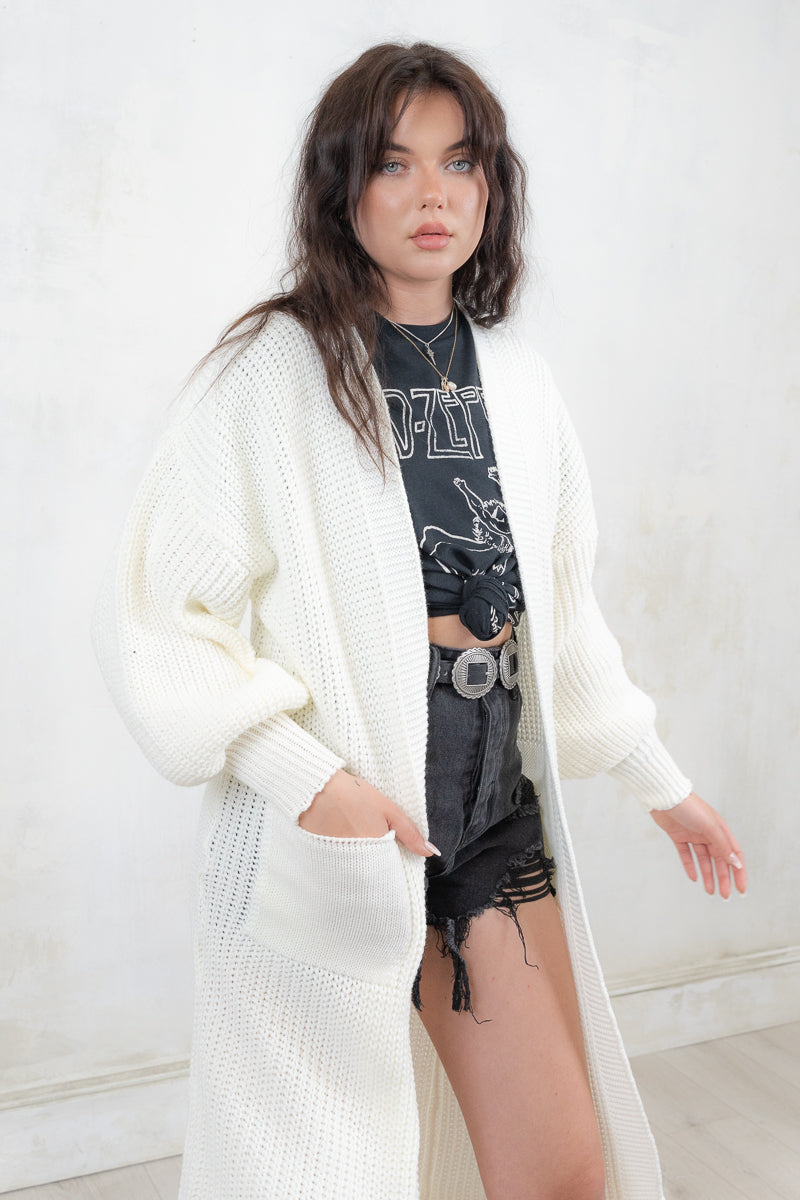 Model wearing All Apologies Cream Cardigan - Cream oversized knit cardigan , Open front with true pockets