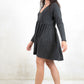 Model wearing Shoot to Thrill Acid Wash Dress, charcoal acid wash jersey smock fit dress with no button or zip closure
