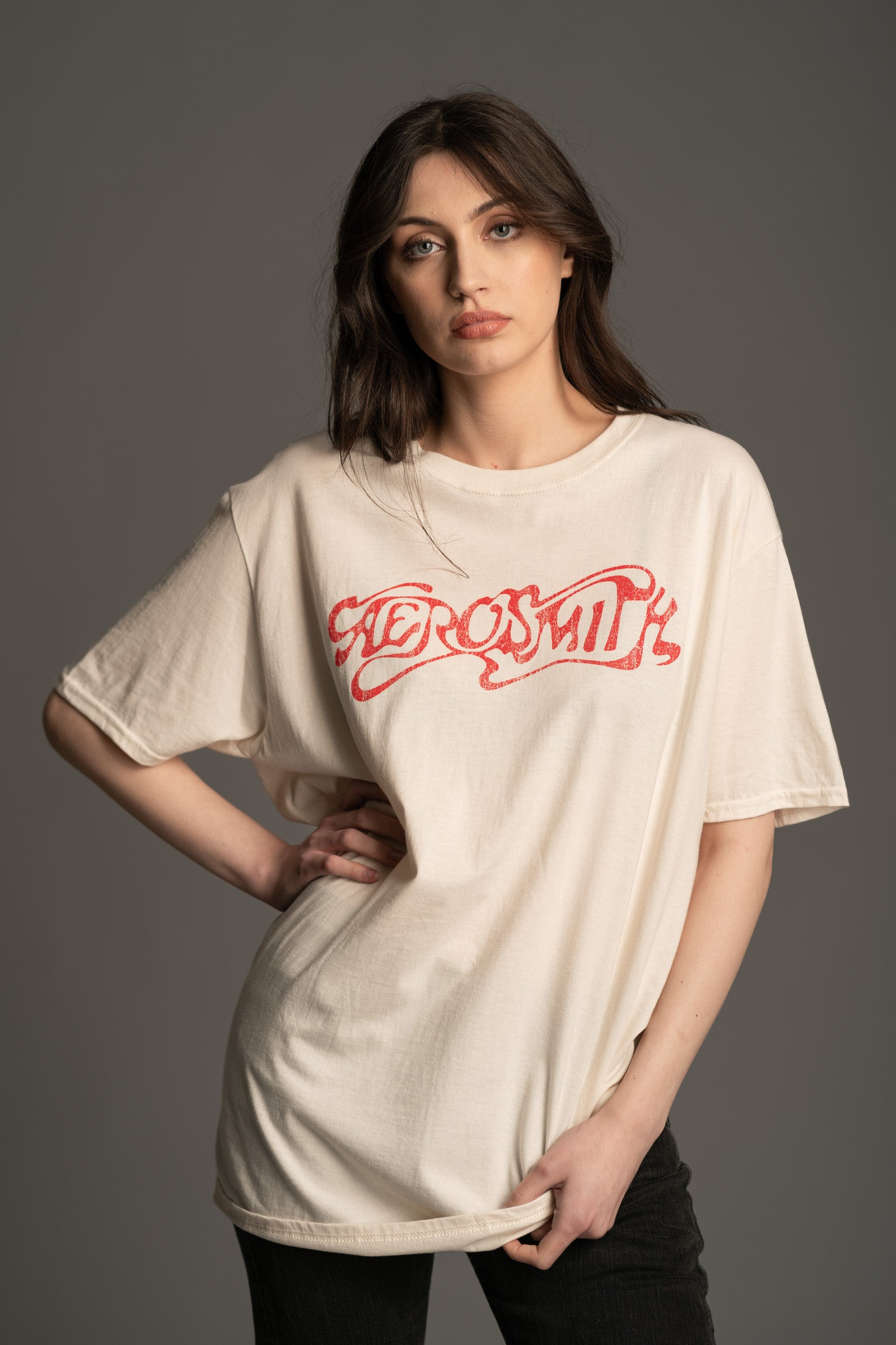 Close-up of Aerosmith classic logo graphic on natural band tee from Little Lies