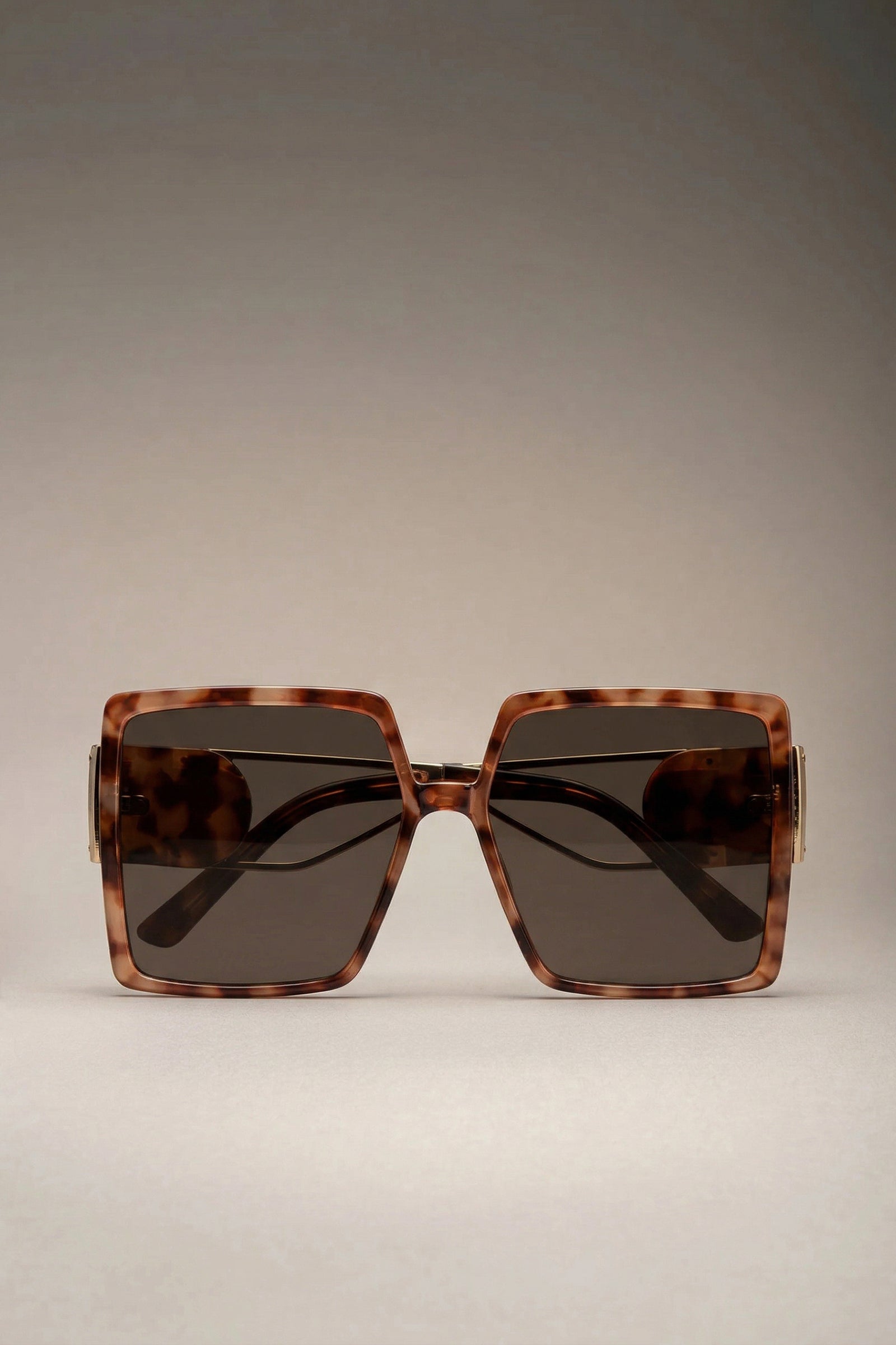 Oversized square tortoiseshell sunglasses front view with tinted lenses