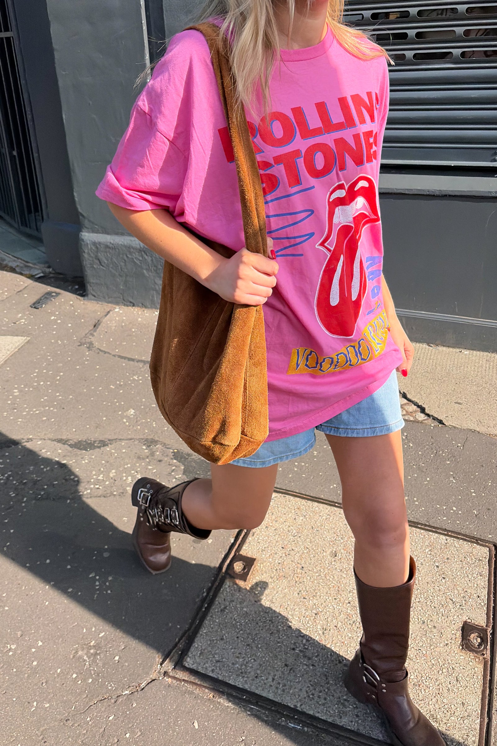 The Rolling Stones Voodoo Lounge band tee in pink – oversized graphic t-shirt front print styled with boots and denim shorts