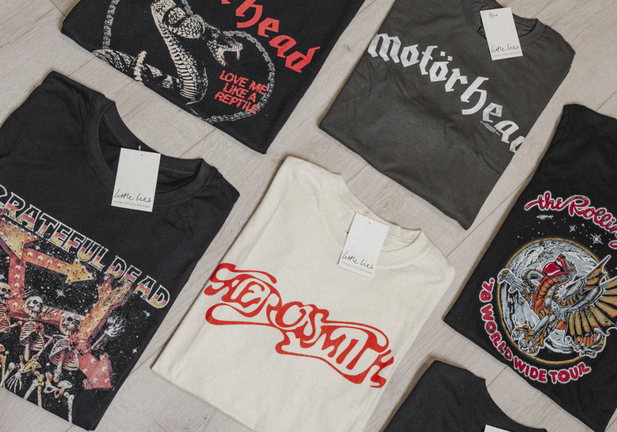 Motorhead, The Rolling Stones, Aerosmith and Grateful Dead Band Tee's laid out on the floor.