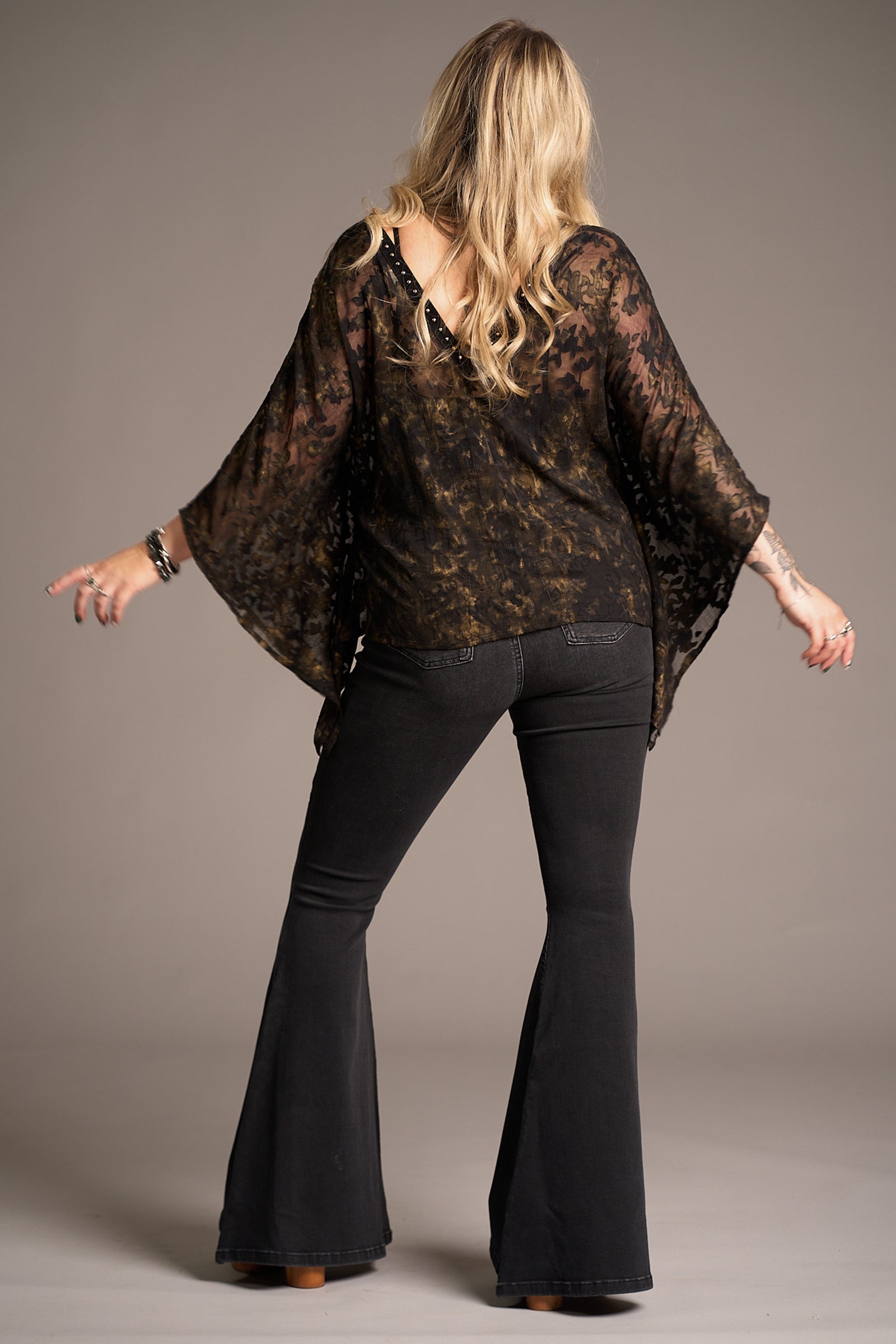 Back view of Erin wearing Bella Donna Studded Kimono Top, showcasing flowy silhouette, Stevie Nicks inspired styling studio