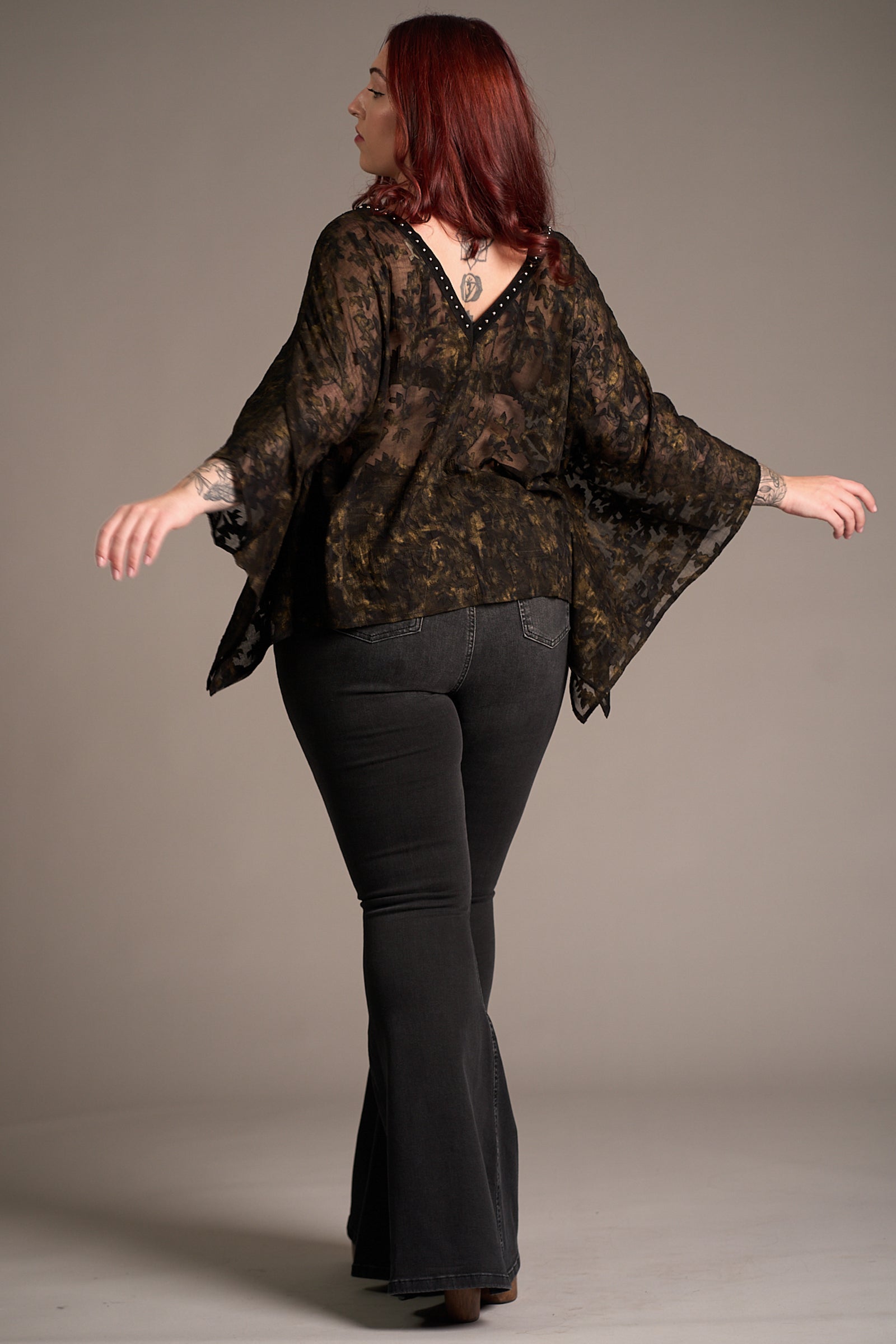 Back view of Taylor wearing Bella Donna Studded Kimono Top, showcasing flowy silhouette, Stevie Nicks inspired styling studio