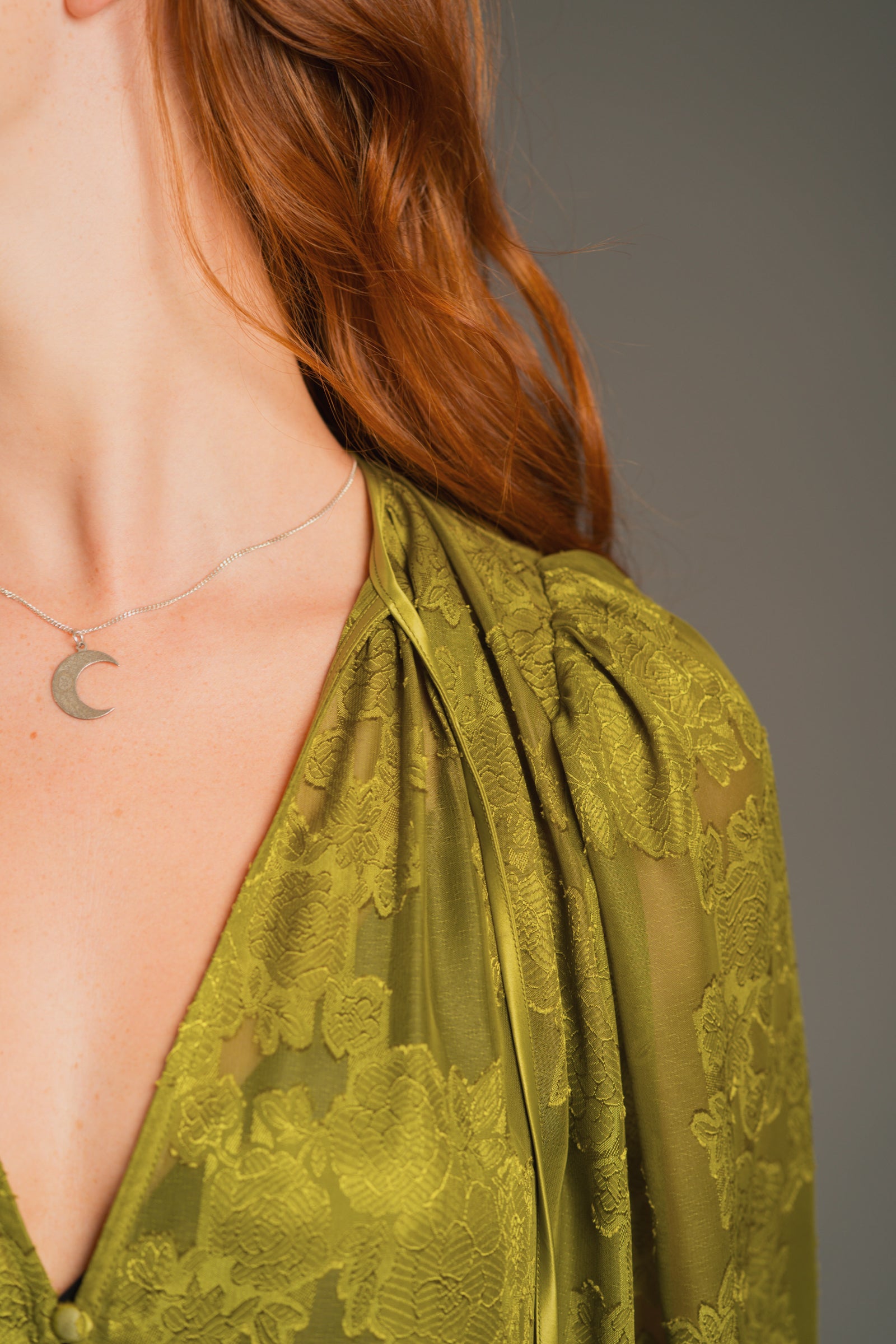 Detailed view of Cassia Olive Smock top neckline and textured chiffon finish