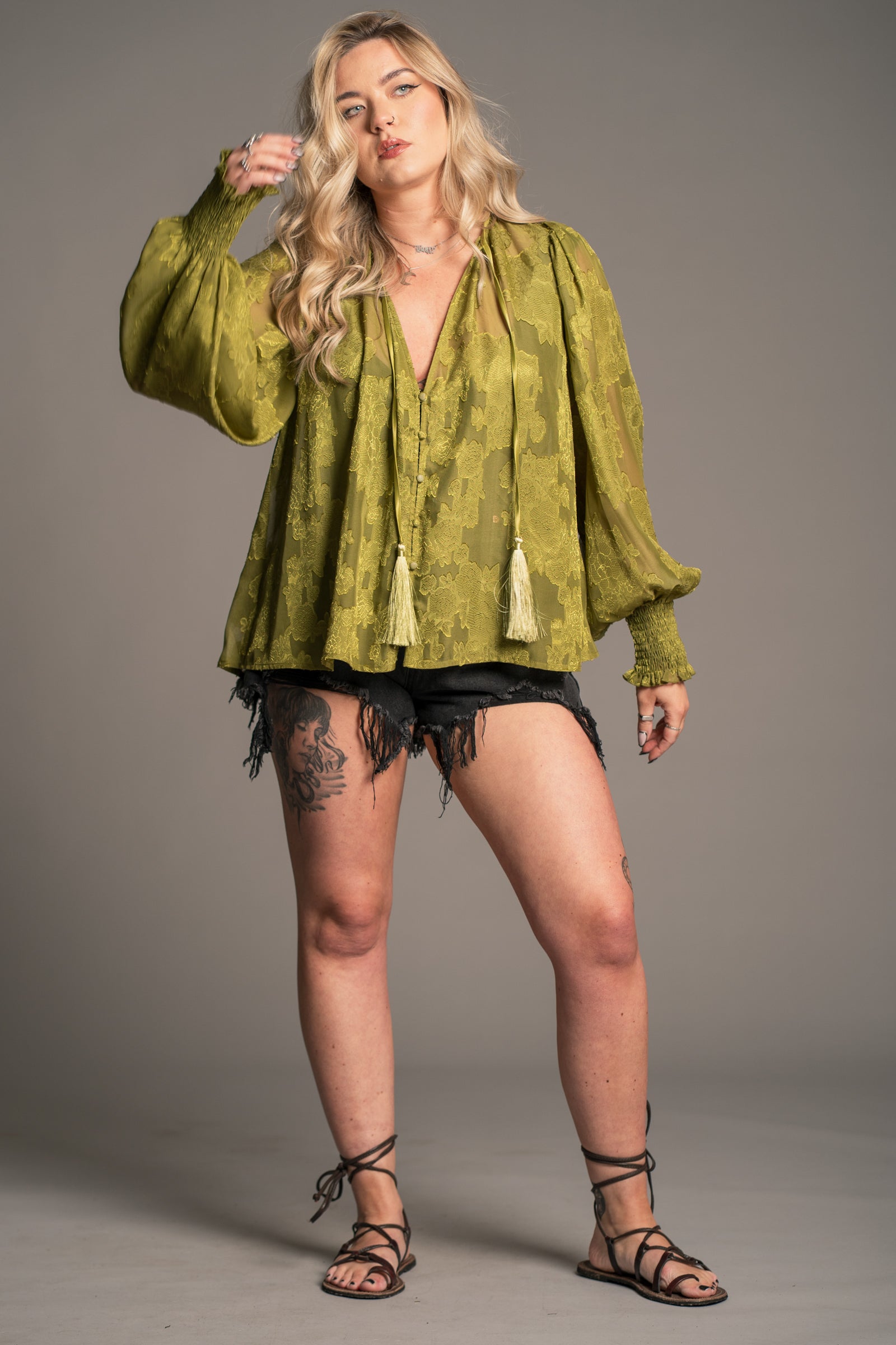 Little Lies Cassia olive chiffon smock top with floral texture, tie neck tassels and relaxed boho fit, on‑model front view