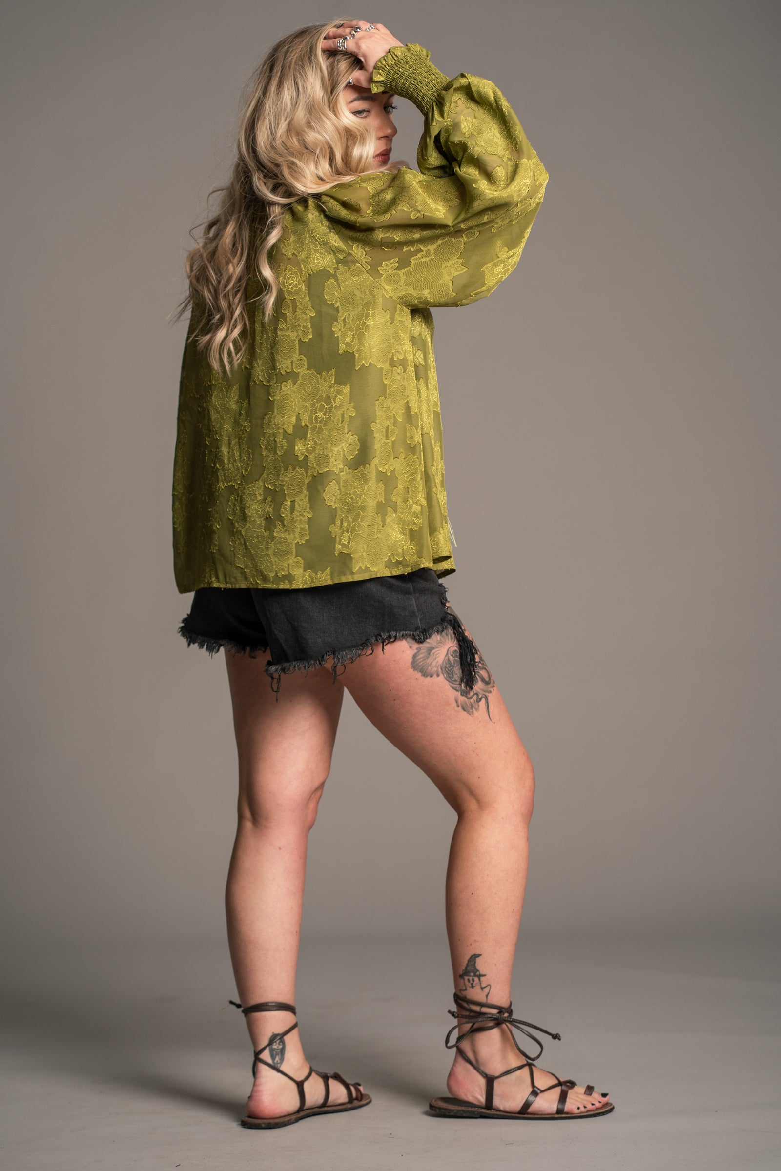 Little Lies Cassia olive chiffon smock top with floral texture and relaxed boho fit, on‑model side back view