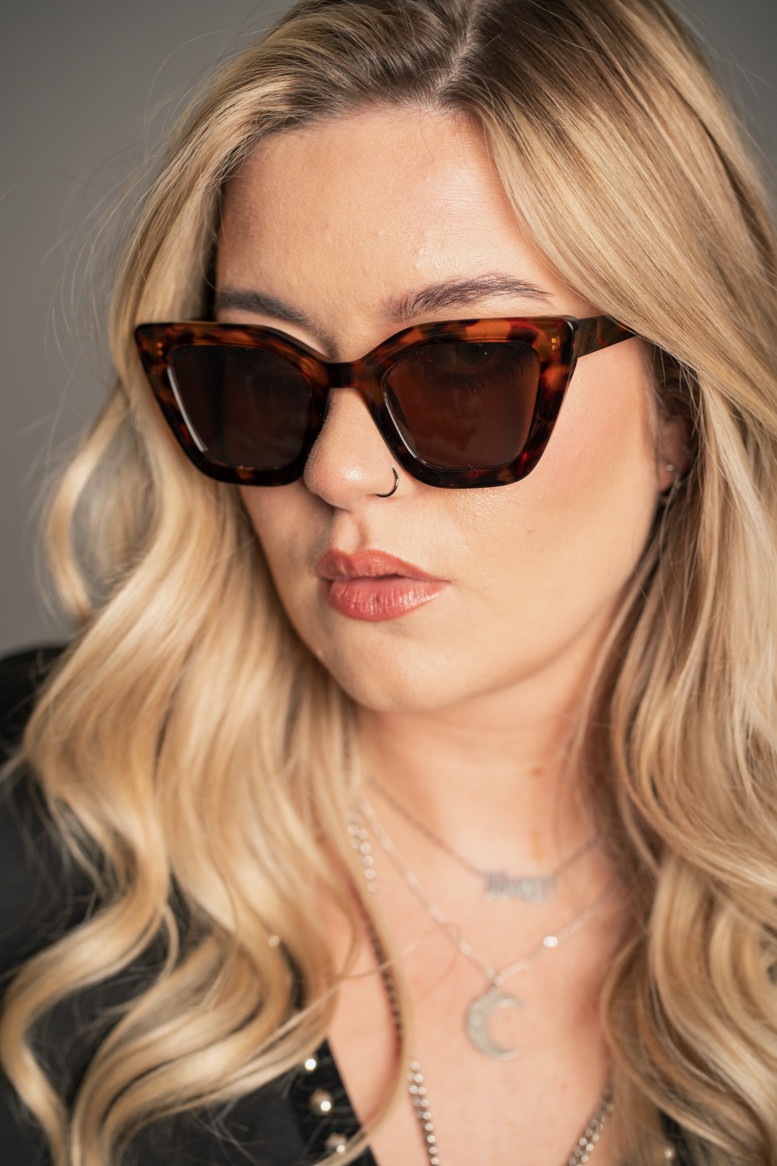 Side profile of Little Lies Cindy Tortoiseshell Cat Eye Sunglasses showing upswept cat-eye silhouette