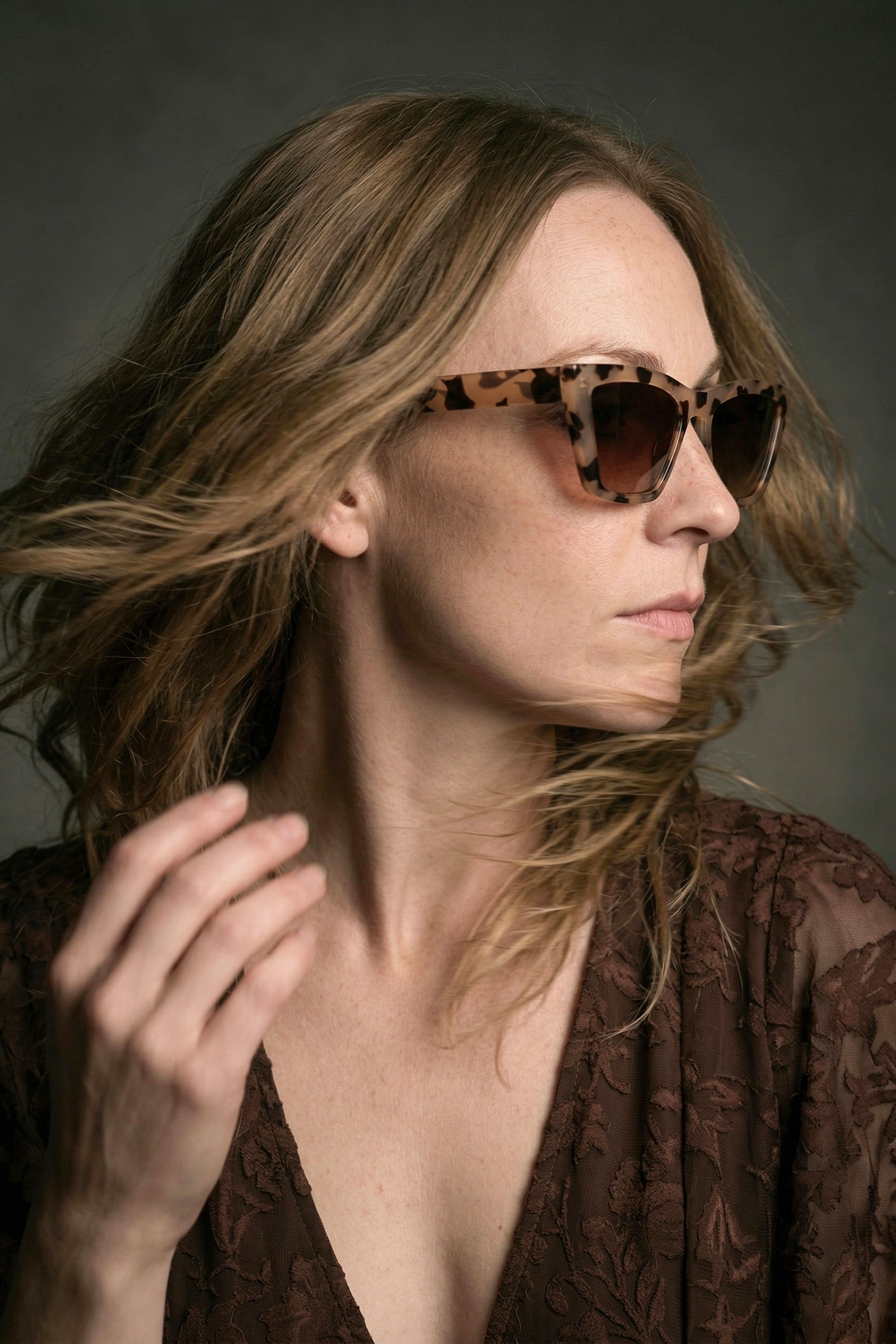 Model wearing cat eye tortoiseshell retro sunglasses styled with Brown Sugar Lace Dress