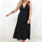 Model wearing Ramble On Midi Dress- Black tassel tie midi dress. With three ways to tie, Ramble On gives the options of a trapeze silhouette, empire fit or a cinched in waist. 