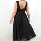 Model wearing Ramble On Midi Dress- Black tassel tie midi dress. With three ways to tie, Ramble On gives the options of a trapeze silhouette, empire fit or a cinched in waist.