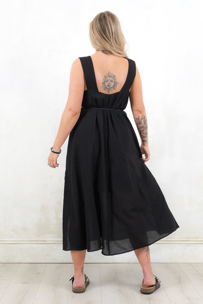 Model wearing Ramble On Midi Dress- Black tassel tie midi dress. With three ways to tie, Ramble On gives the options of a trapeze silhouette, empire fit or a cinched in waist.