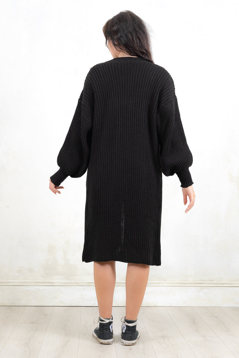 Model wearing All Apologies Black Cardigan - Black oversized knit cardigan , Open front with true pockets