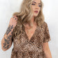 Model wearing Come as You Are Leopard Dress, leopard print, v-neck smock dress with no button or zip fastenings