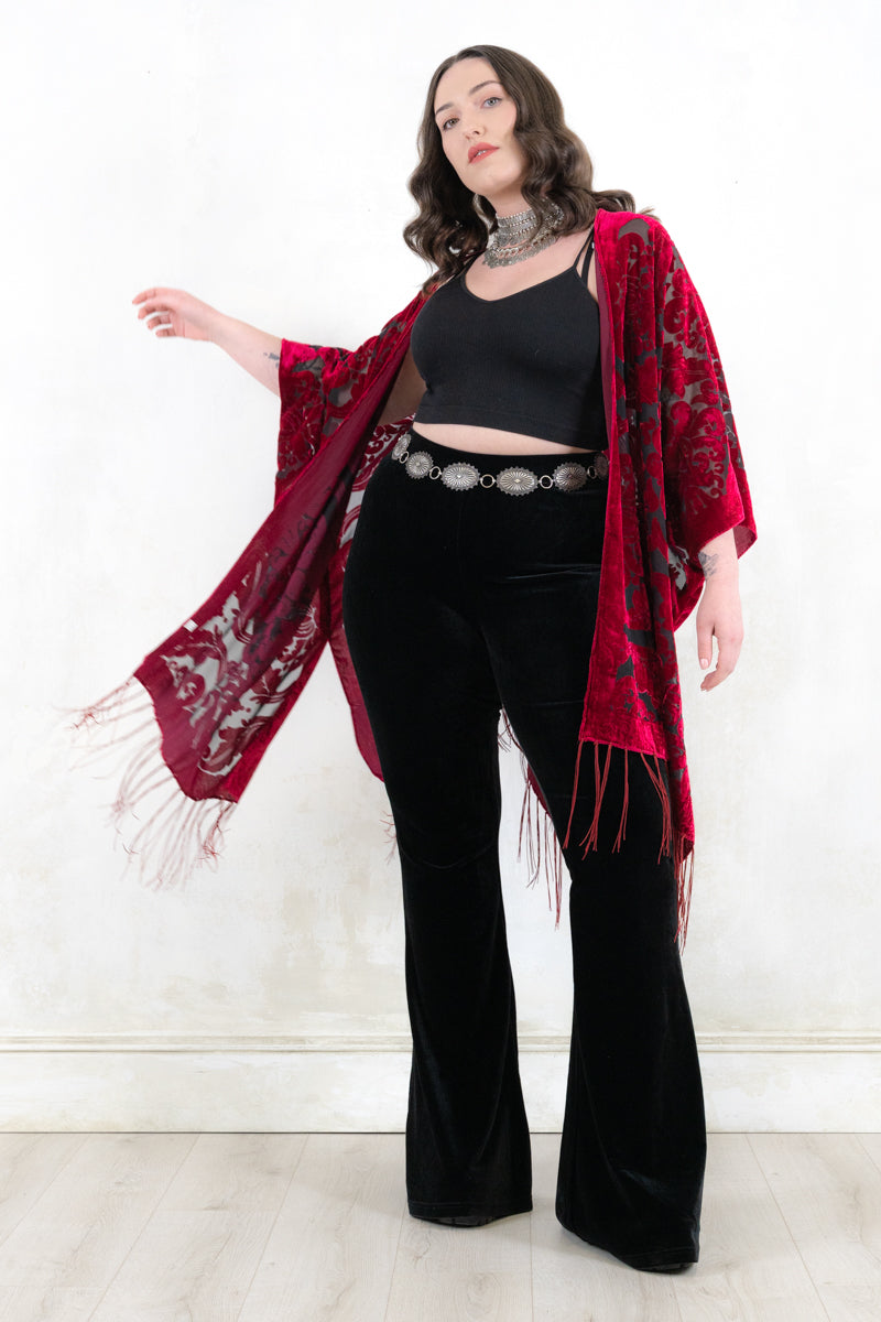 Model wearing Mystic Queen Raspberry Devore Kimono - raspberry devore burnout velvet kimono with a relaxed shape adorned with fringing