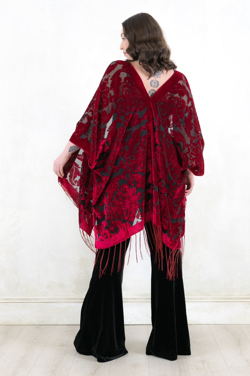 Model wearing Mystic Queen Raspberry Devore Kimono - raspberry devore burnout velvet kimono with a relaxed shape adorned with fringing