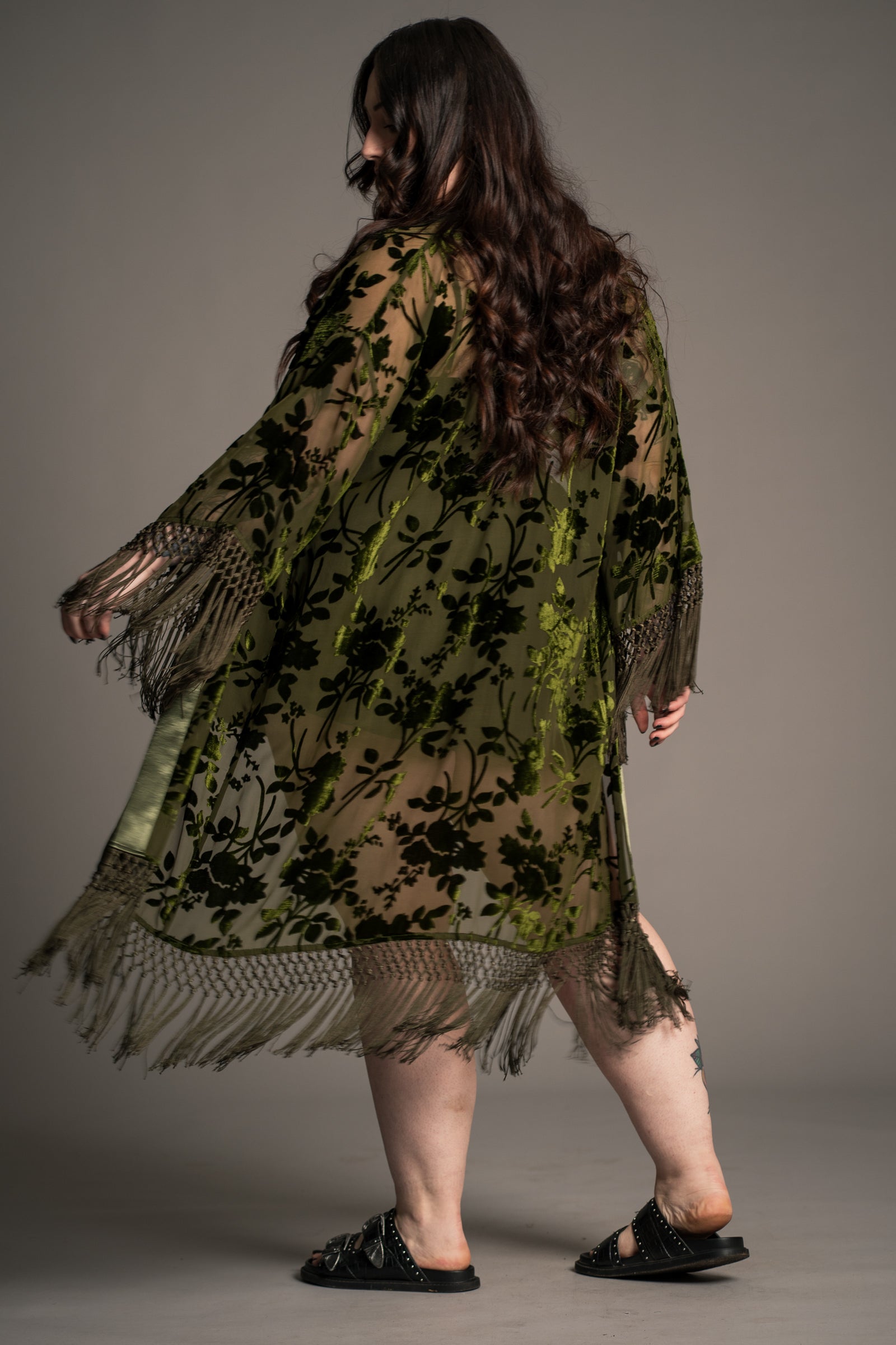 Back view of Little Lies Dakota olive devore kimono with sheer floral velvet pattern and relaxed drape with tassel trim