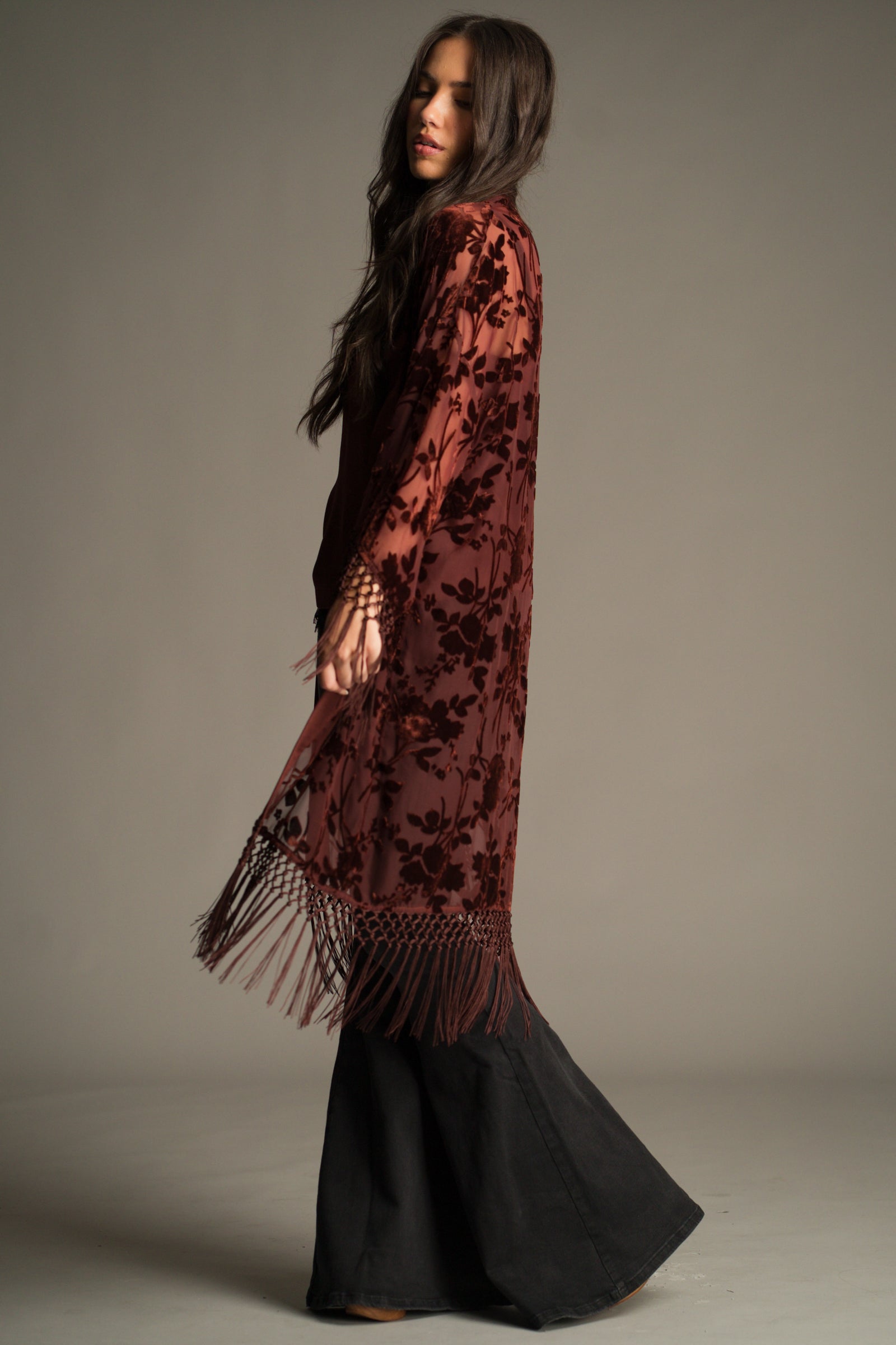 Back view of the Dakota Rust Devore Kimono showing tassel fringe and longline silhouette.