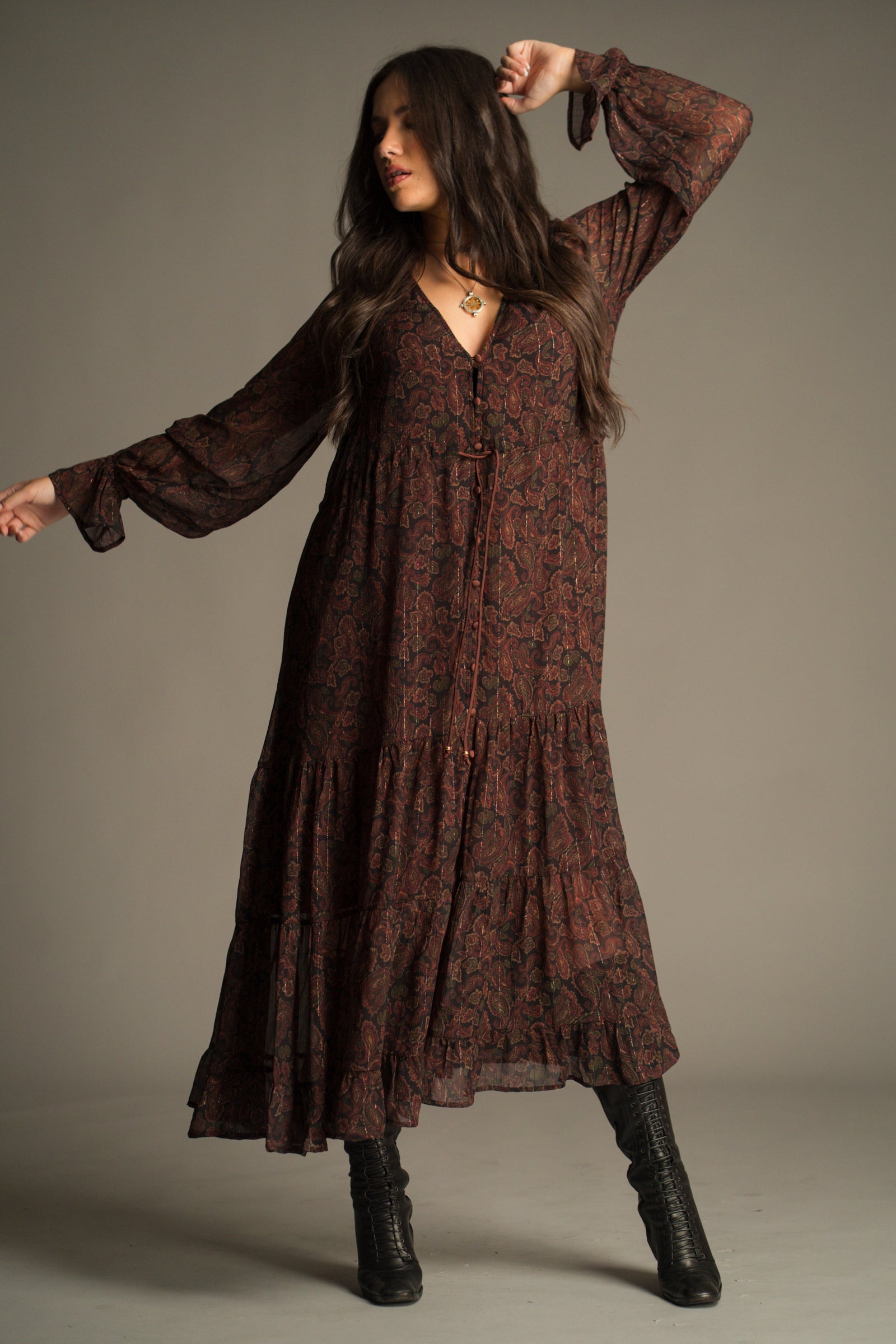 Full length view of the Dark Paradise Paisley Maxi Dress showing fluid maxi silhouette and sheer sleeves.