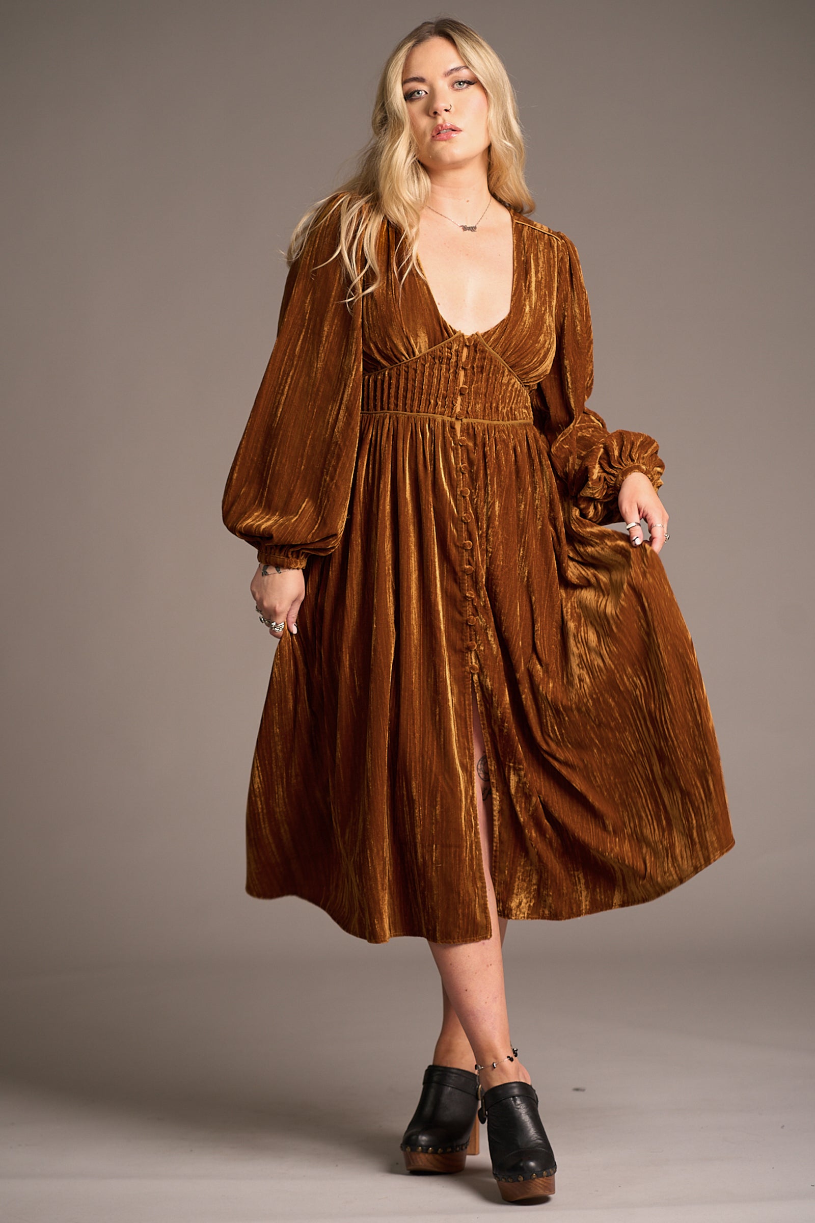 Erin modelling the Dazed Copper Velvet Midi Dress with voluminous sleeves, deep V-neckline, and button-down front, Stevie Nicks inspired styling studio