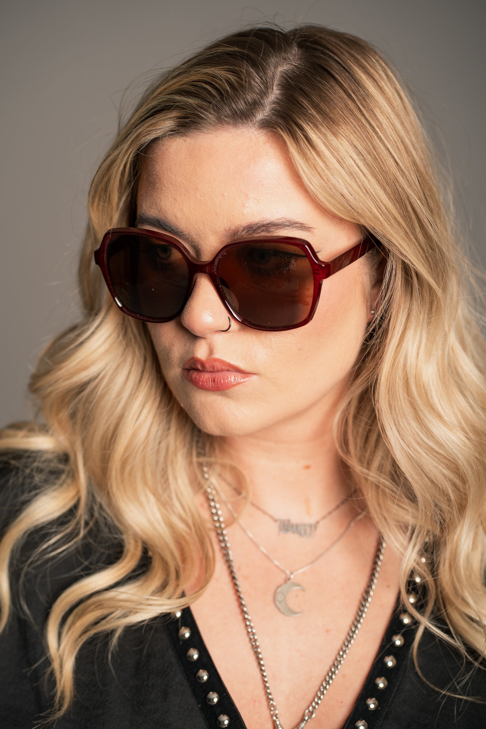 Little Lies Diana sunglasses in deep red frame with bold square shape and tinted lenses