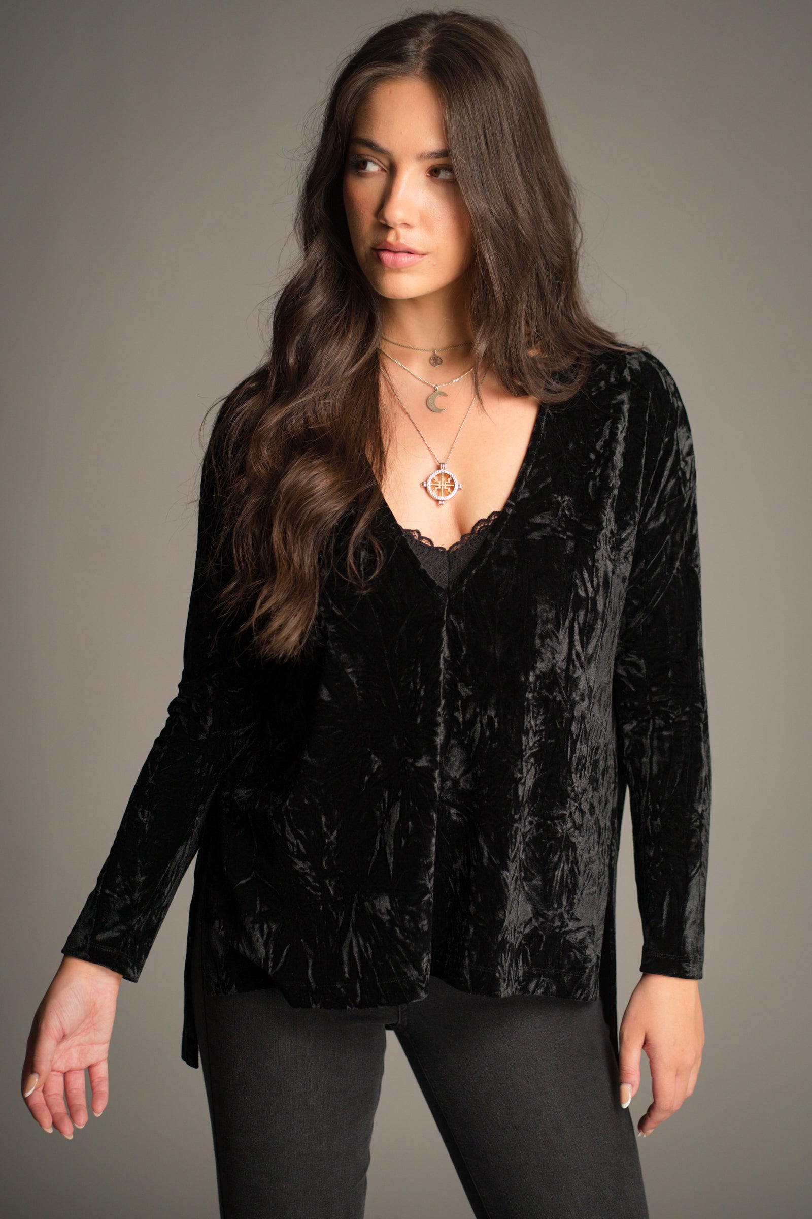 Close-up front view of the Dylan Black Crushed Velvet Tee showing V-neckline and velvet texture.