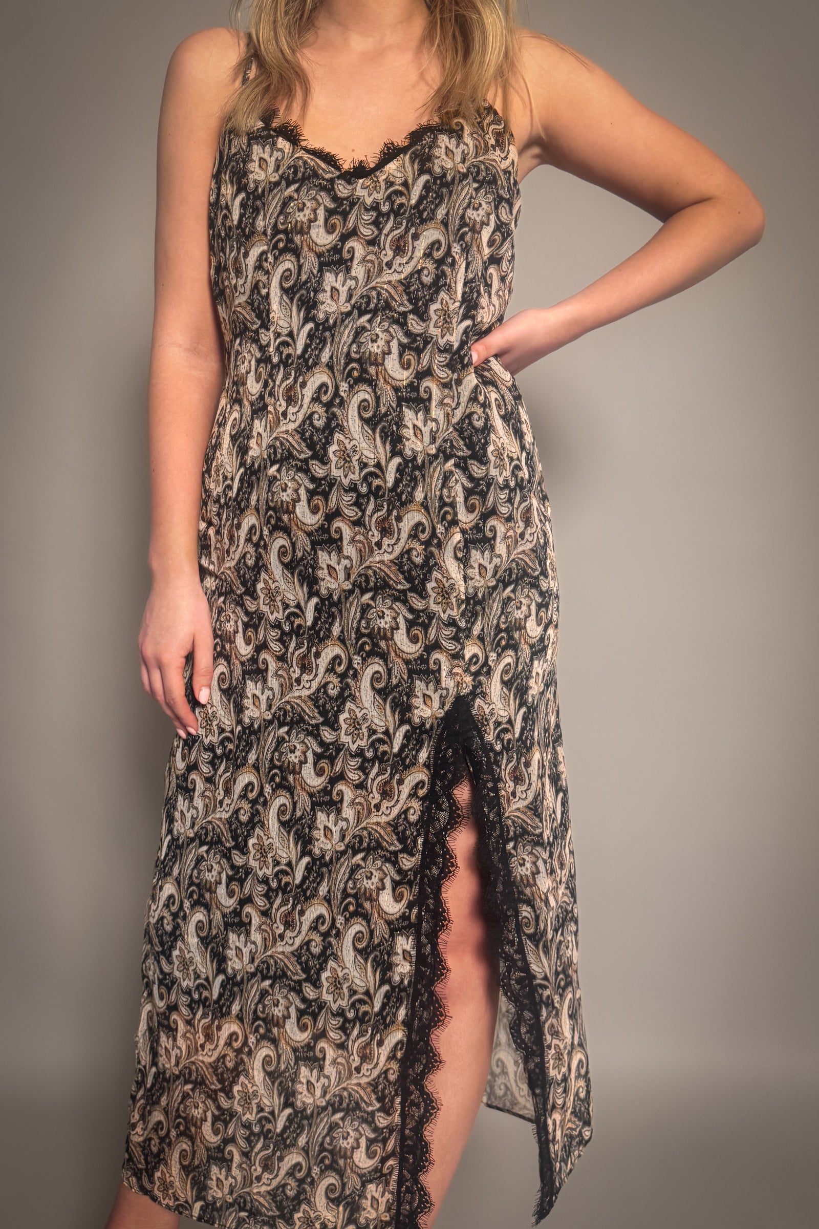 Little Lies Eleanor Paisley Slip Dress styled showing lace detailed side split. 