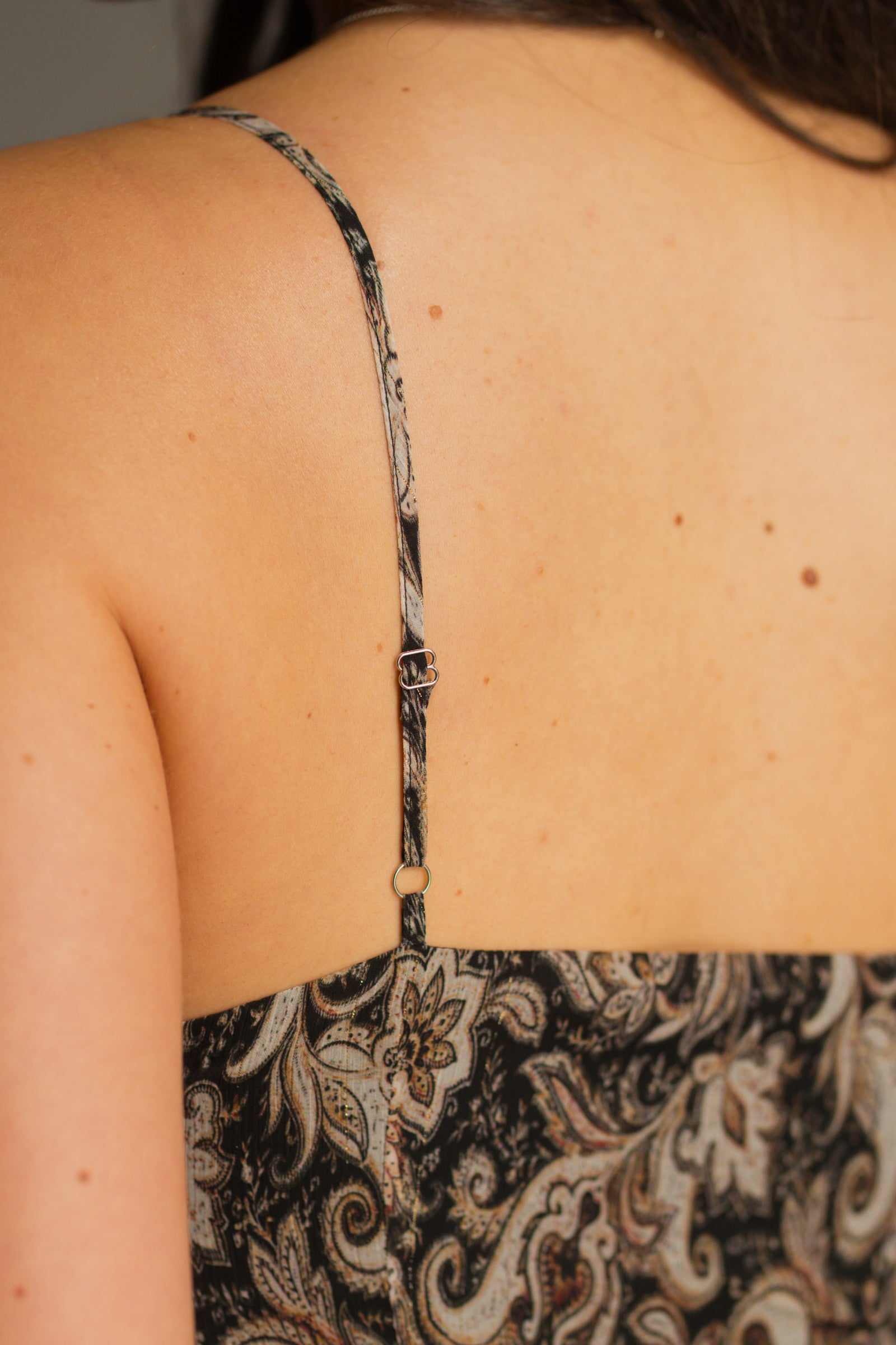 Back view of Little Lies Eleanor Paisley Slip Dress showing adjustable straps details and paisley print.