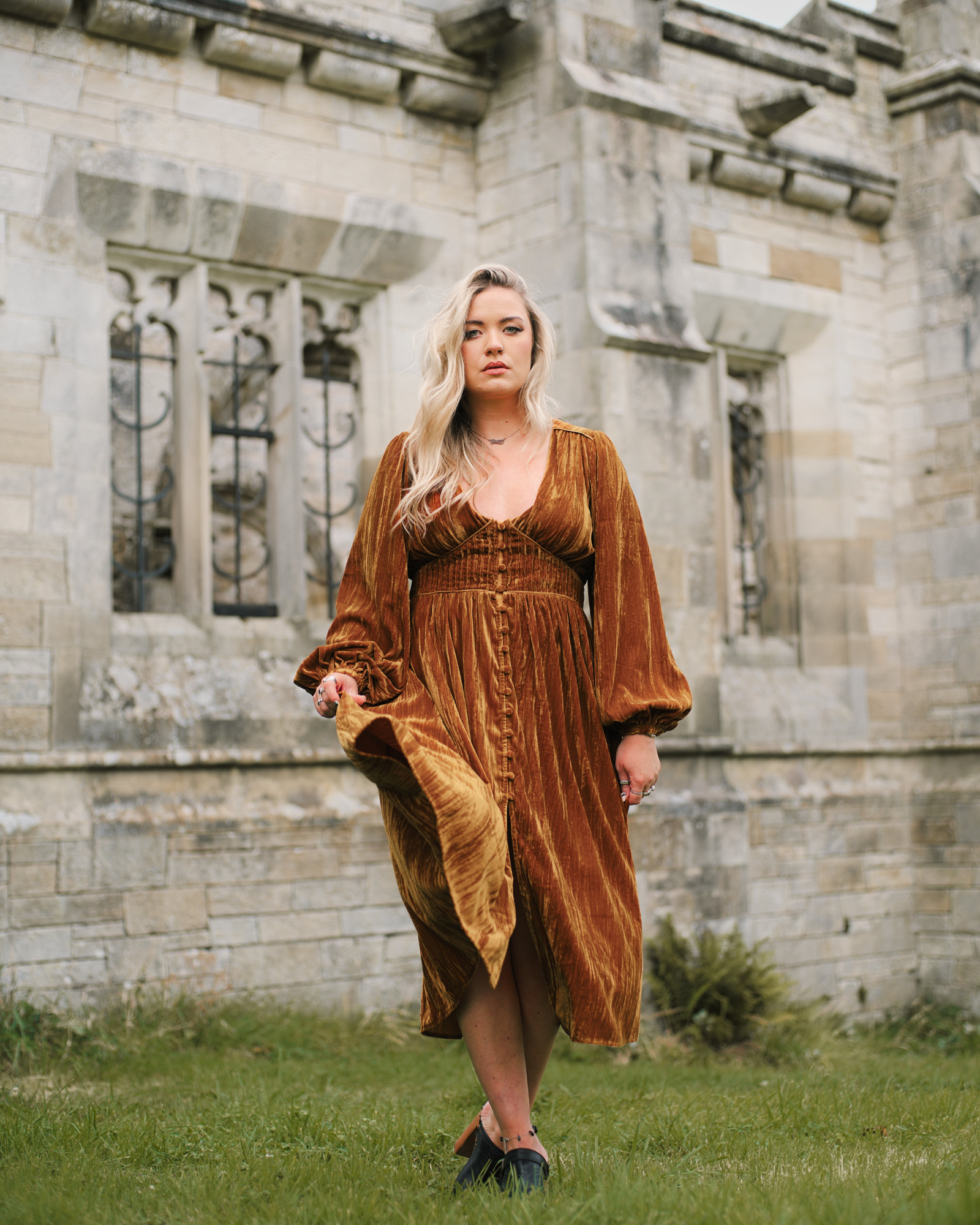 Erin in Dazed Copper Velvet Midi Dress, Stevie Nicks inspired styling set against gothic stone architecture