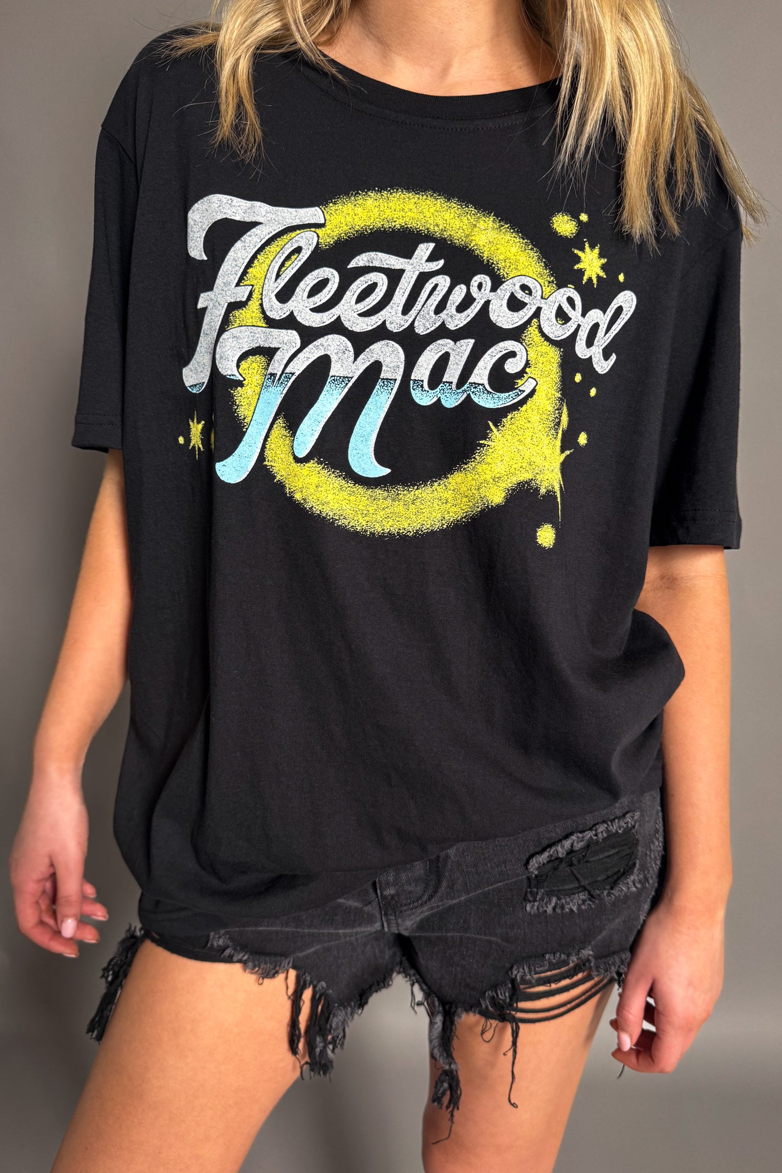 Side view of the Fleetwood Mac Circle Logo band t-shirt in black.