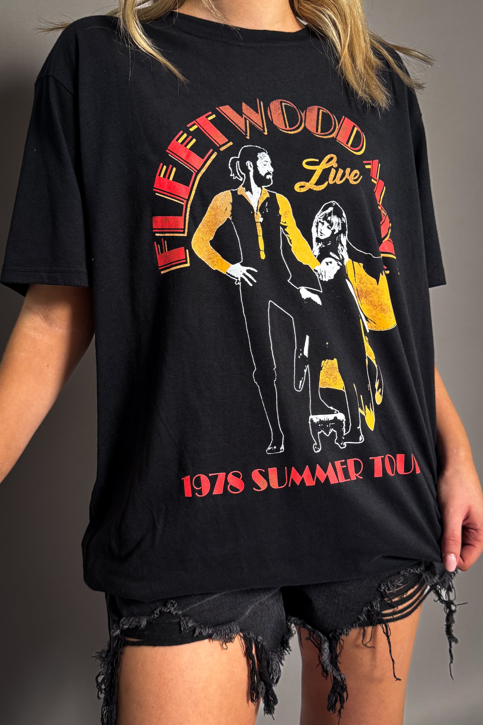 Side view of the Fleetwood Mac Summer Tour band t-shirt in black.