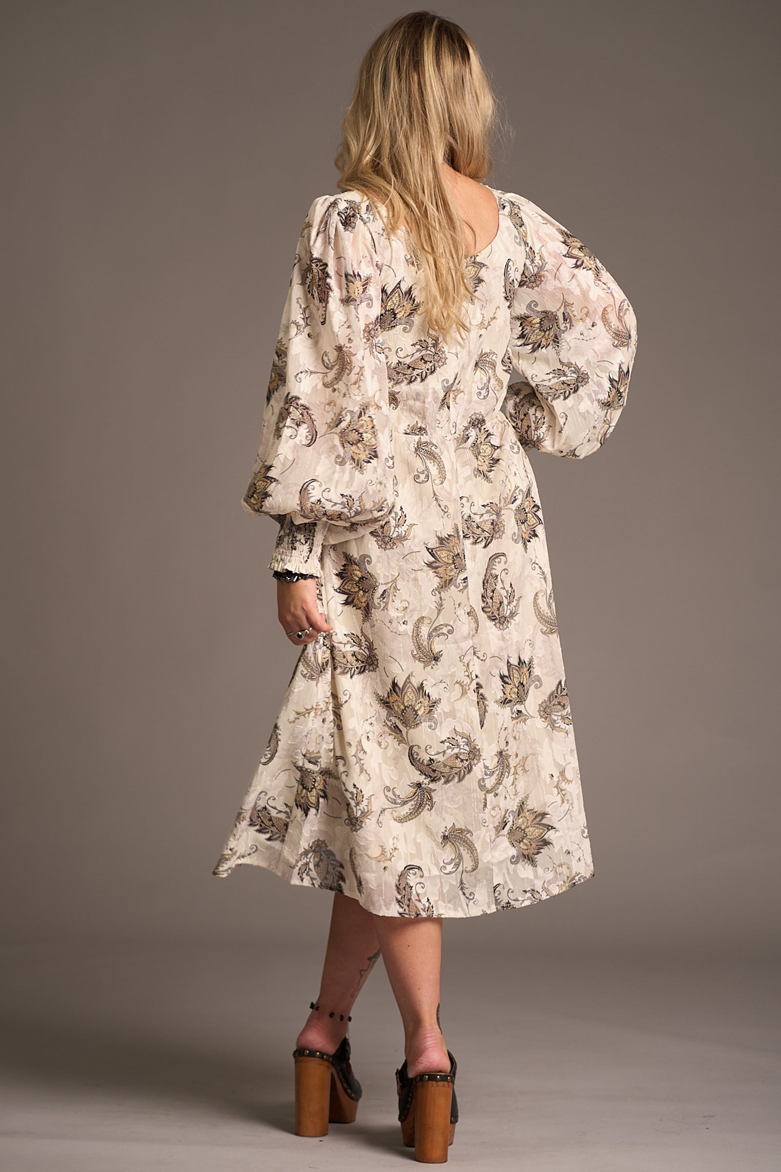 Erin showing the back of the Harvest Moon Paisley Midi Dress, Stevie Nicks inspired styling studio