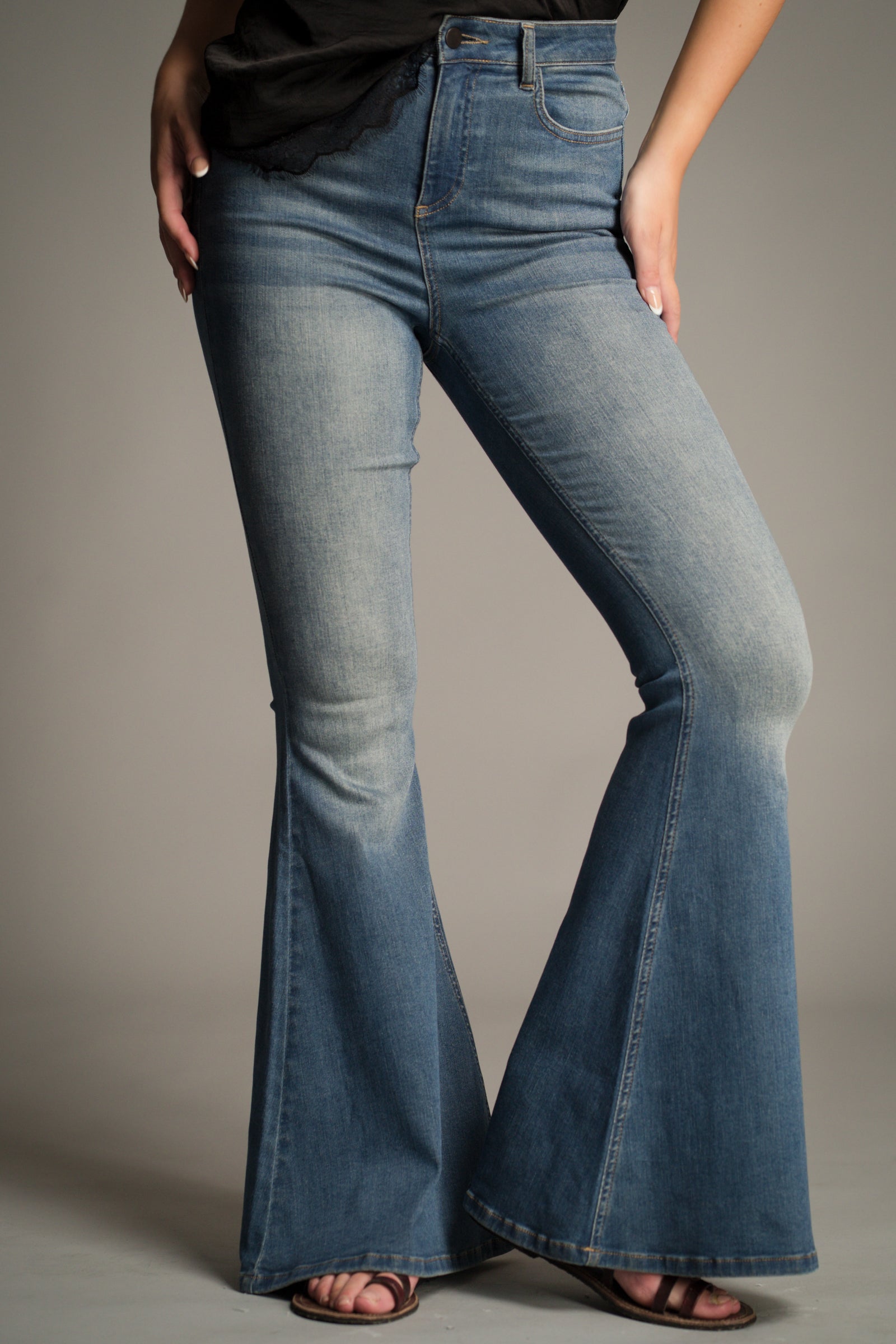 Side view of the Hendrix Blue Denim Flares showing high-waist fit and bell-bottom flare.