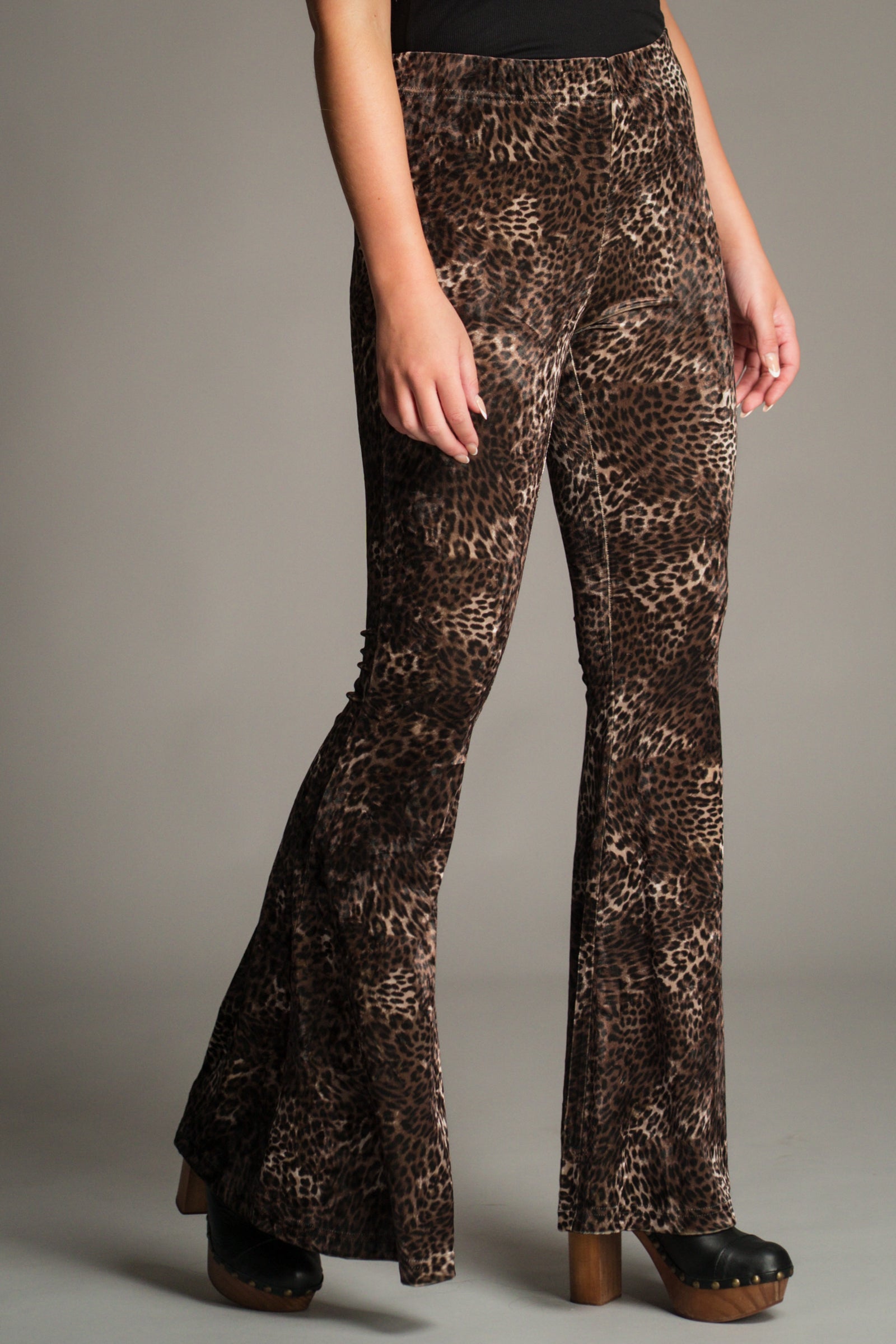 Close-up front view of the Hendrix Leopard Velvet Flares showing velvet texture and high-waist fit.