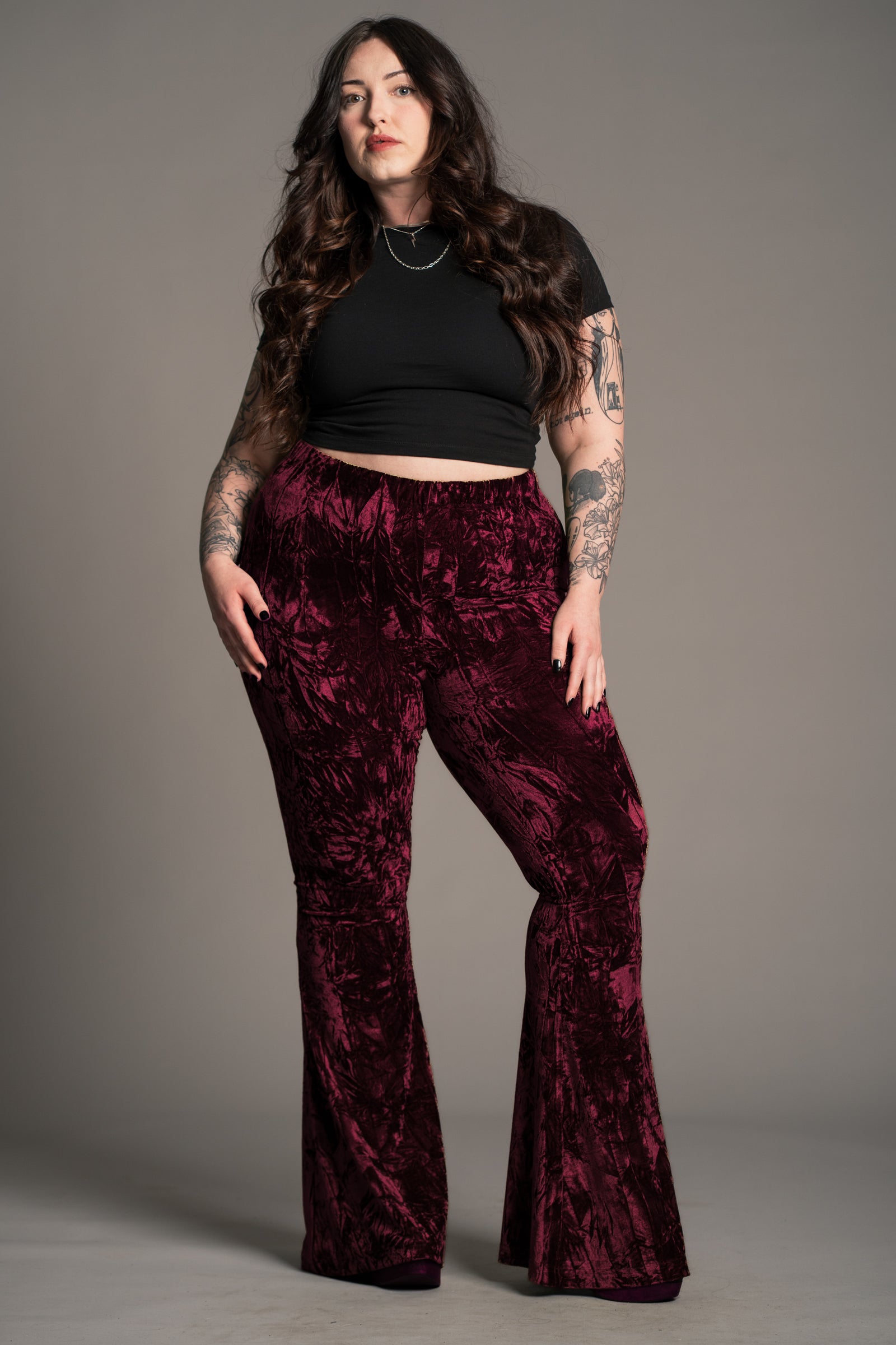 Plus size front view of the Hendrix Merlot Crushed Velvet Flares in rich merlot velvet.