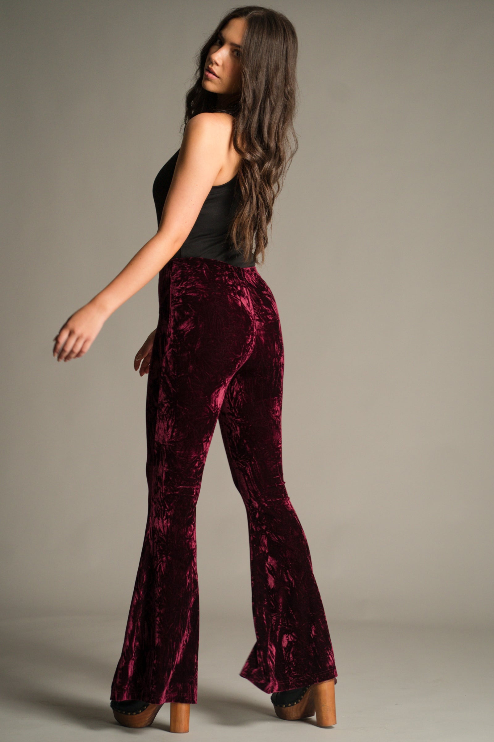 Back view of the Hendrix Merlot Crushed Velvet Flares showing flared leg and high-waist fit.