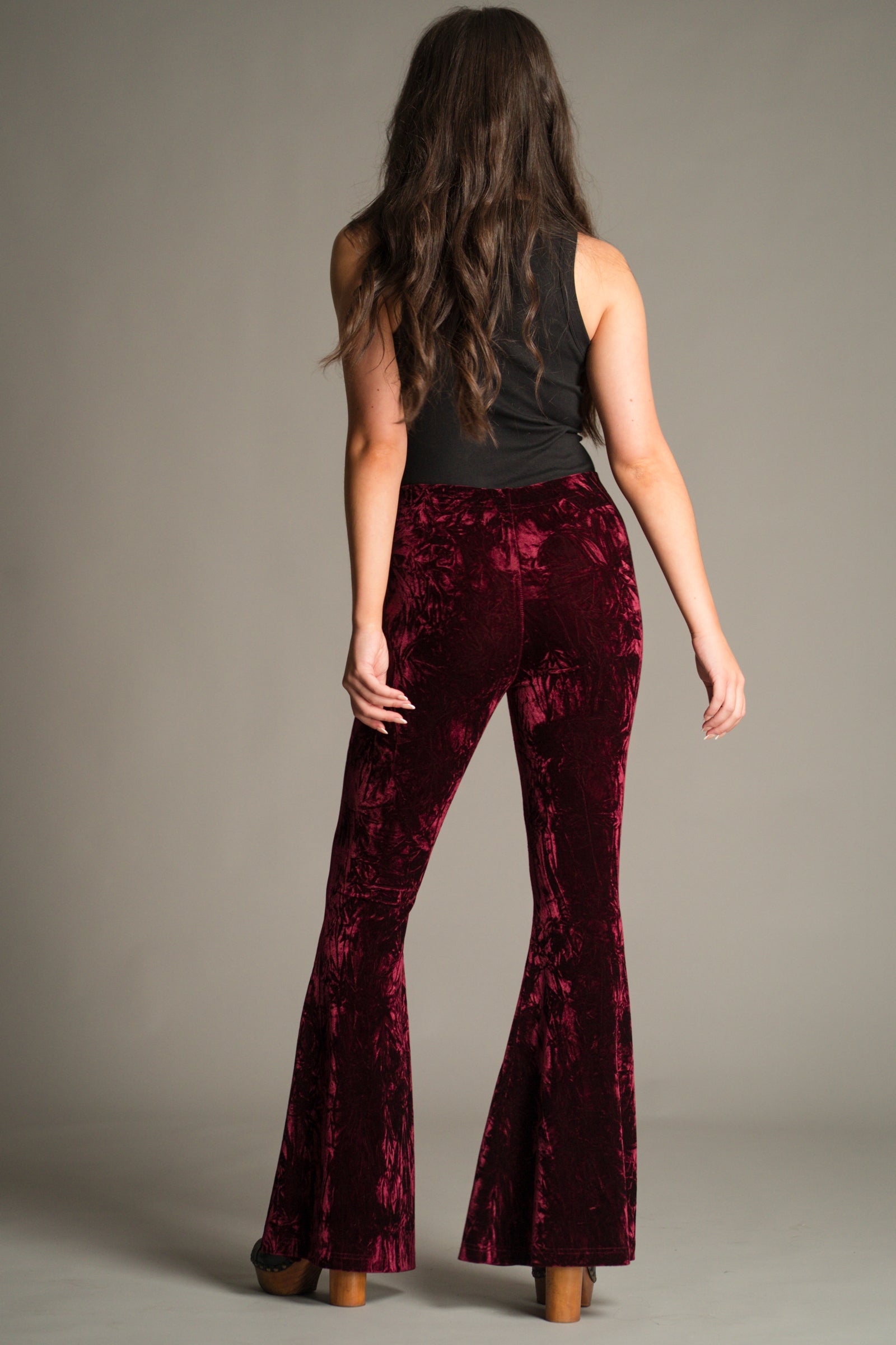 Full length back view of the Hendrix Merlot Crushed Velvet Flares in rich merlot crushed velvet.