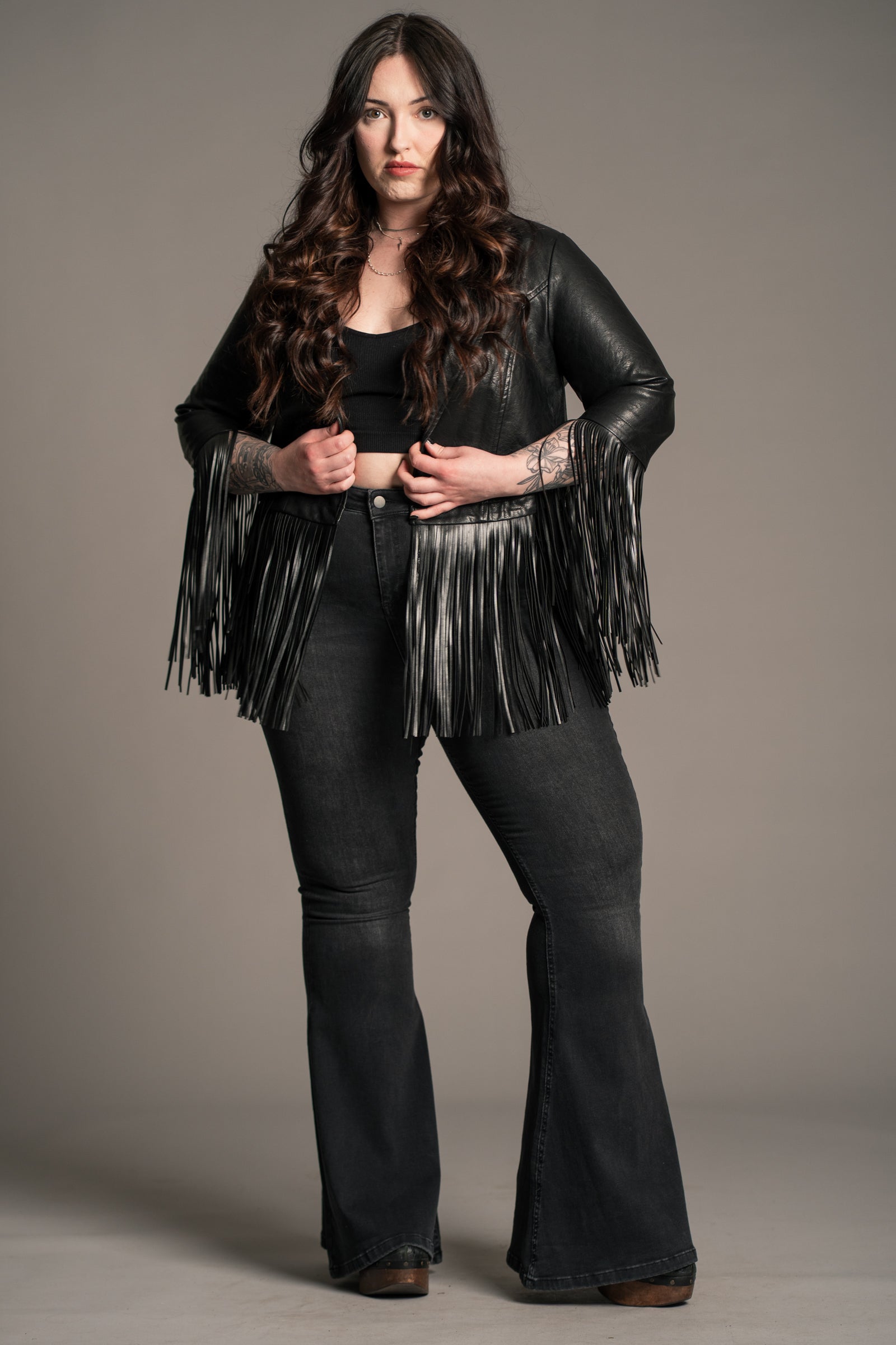 Close-up of lapel and shoulder on Little Lies Jagger Fringed Faux Leather Jacket showing blazer detail