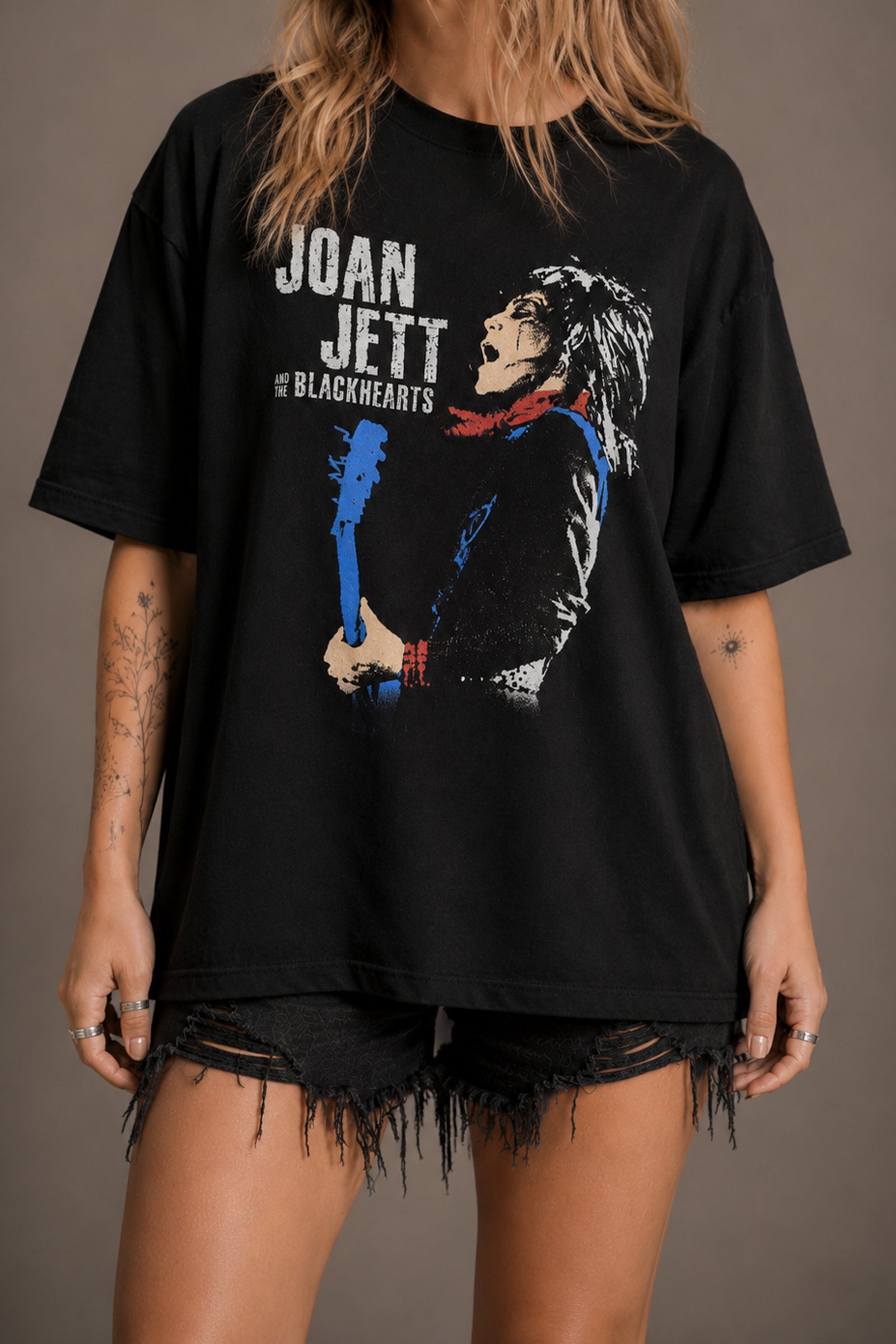 Close-up of blue guitar performance graphic on Little Lies Joan Jett and The Blackhearts Band Tee in black