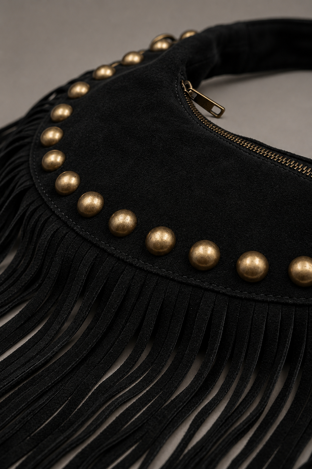 Little Lies Kate black genuine suede studded fringe bag with gold stud detail, tassel trim and zip closure, close‑up detail view
