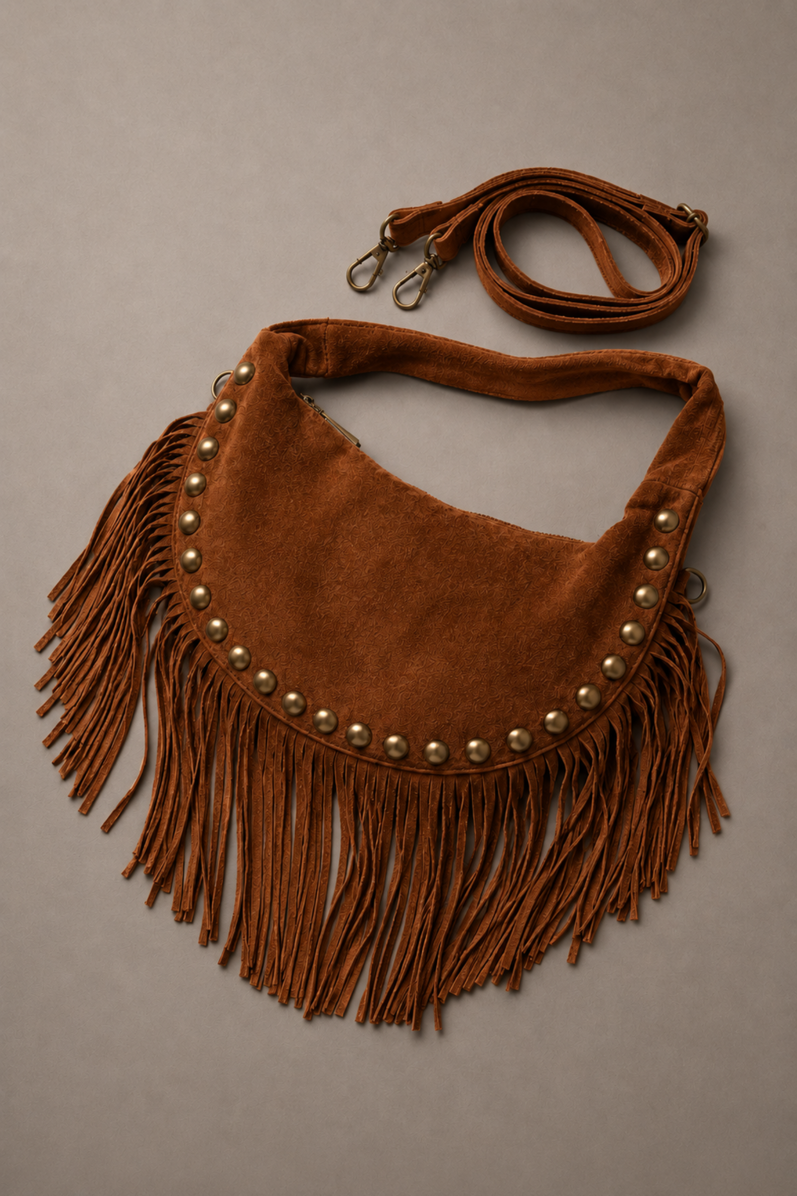 Little Lies Kate tan suede studded bag with detachable strap – flat lay showing fringe and hardware