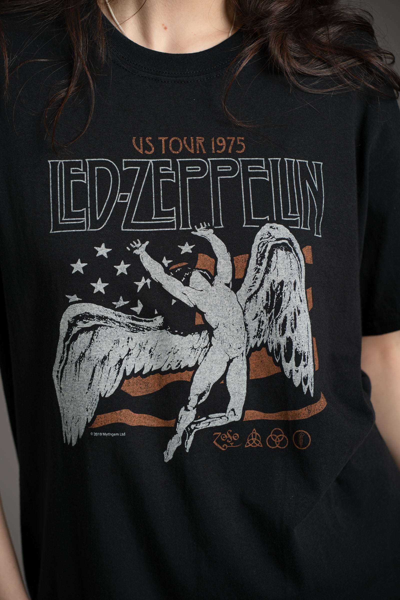 Close-up of Led Zeppelin 1975 Band tee graphic featuring the U.S flag with an angelic figure design from Little Lies collection