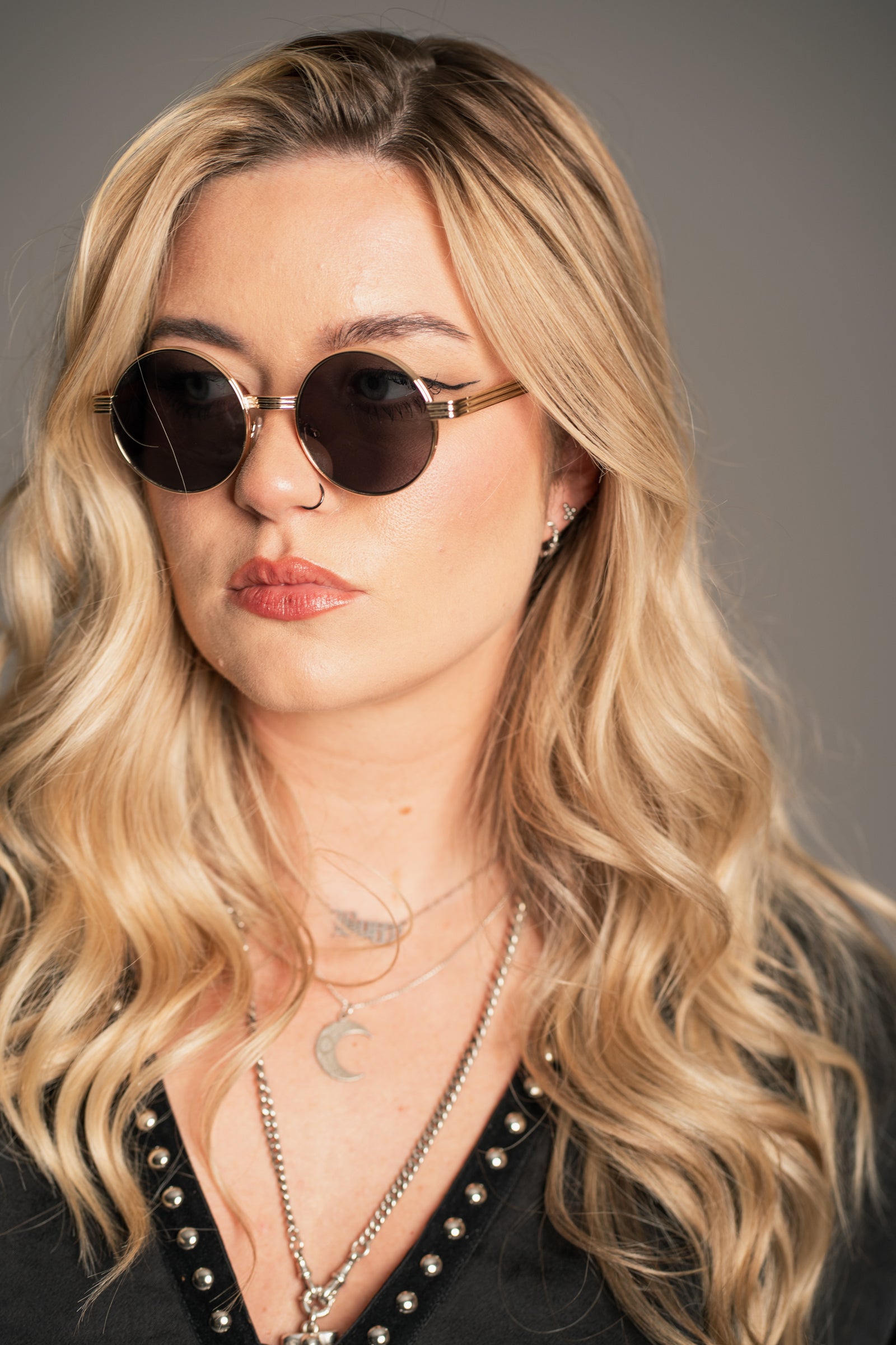 Close-up of Little Lies Lennon Vintage Round Metal Sunglasses showing slim gold frame and round lens detail