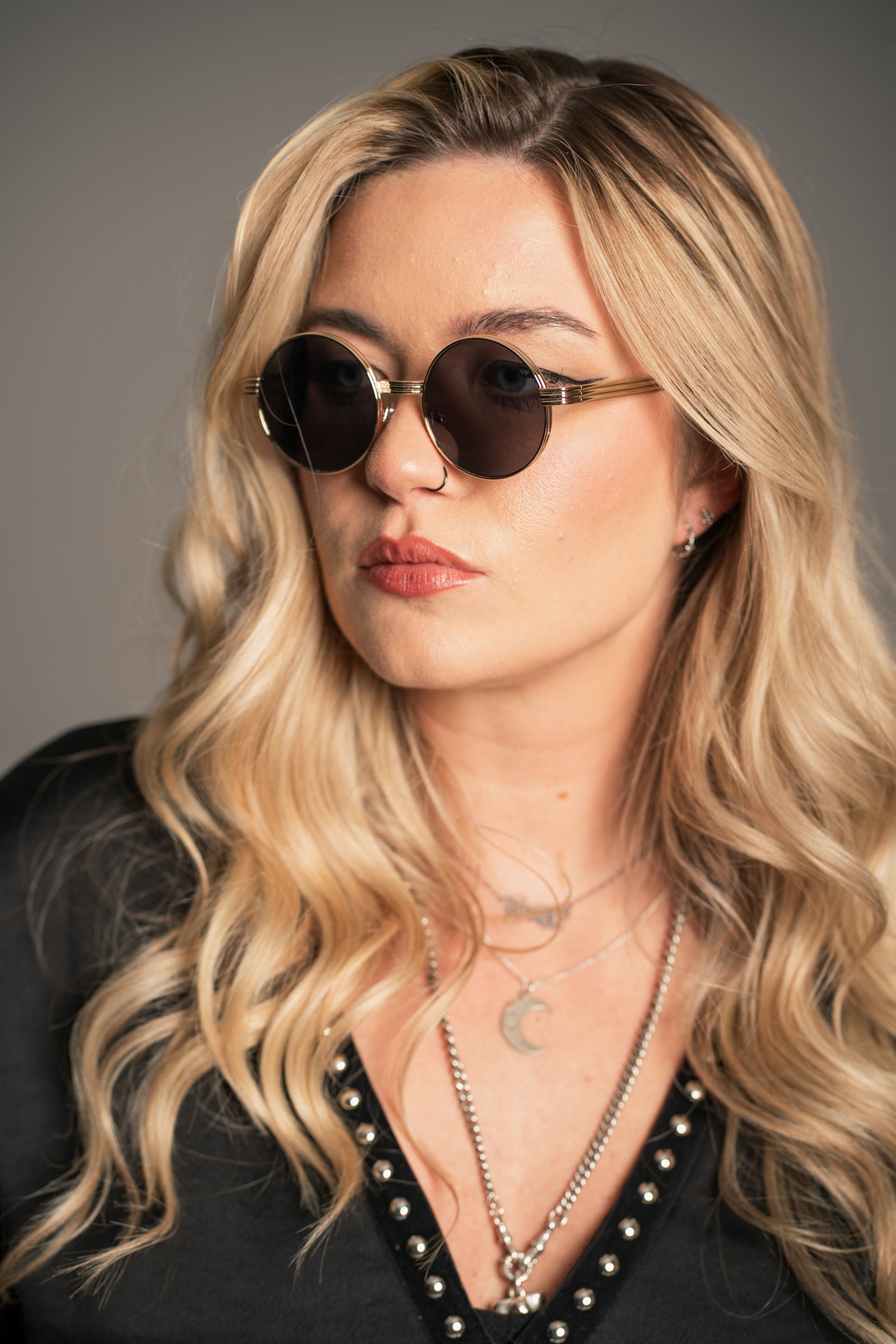 Little Lies Lennon vintage round metal sunglasses with gold frame and dark tinted lenses