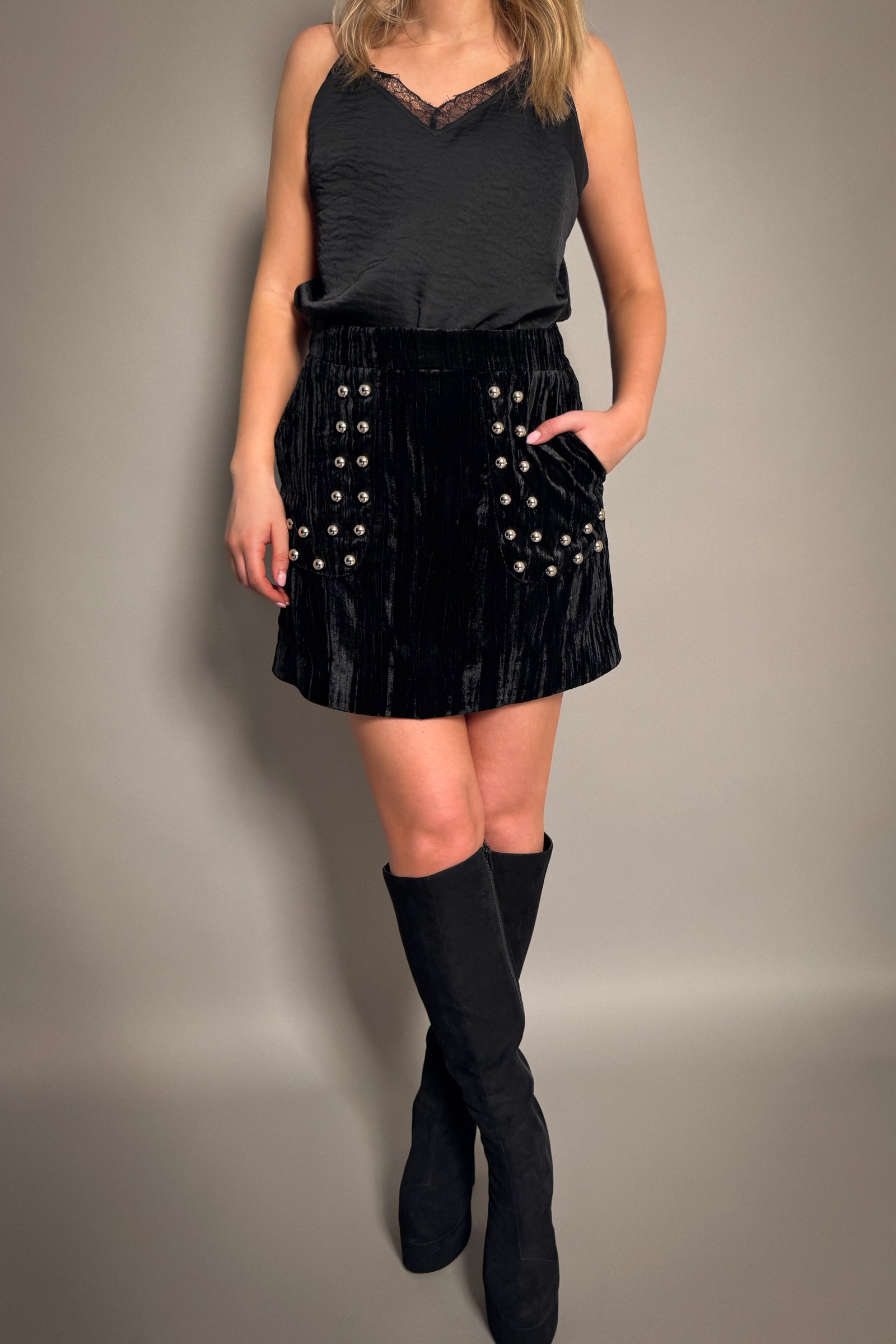 Little Lies Lennon studded velvet mini skirt in black with soft textured fabric, A-line silhouette and silver stud pocket detailing