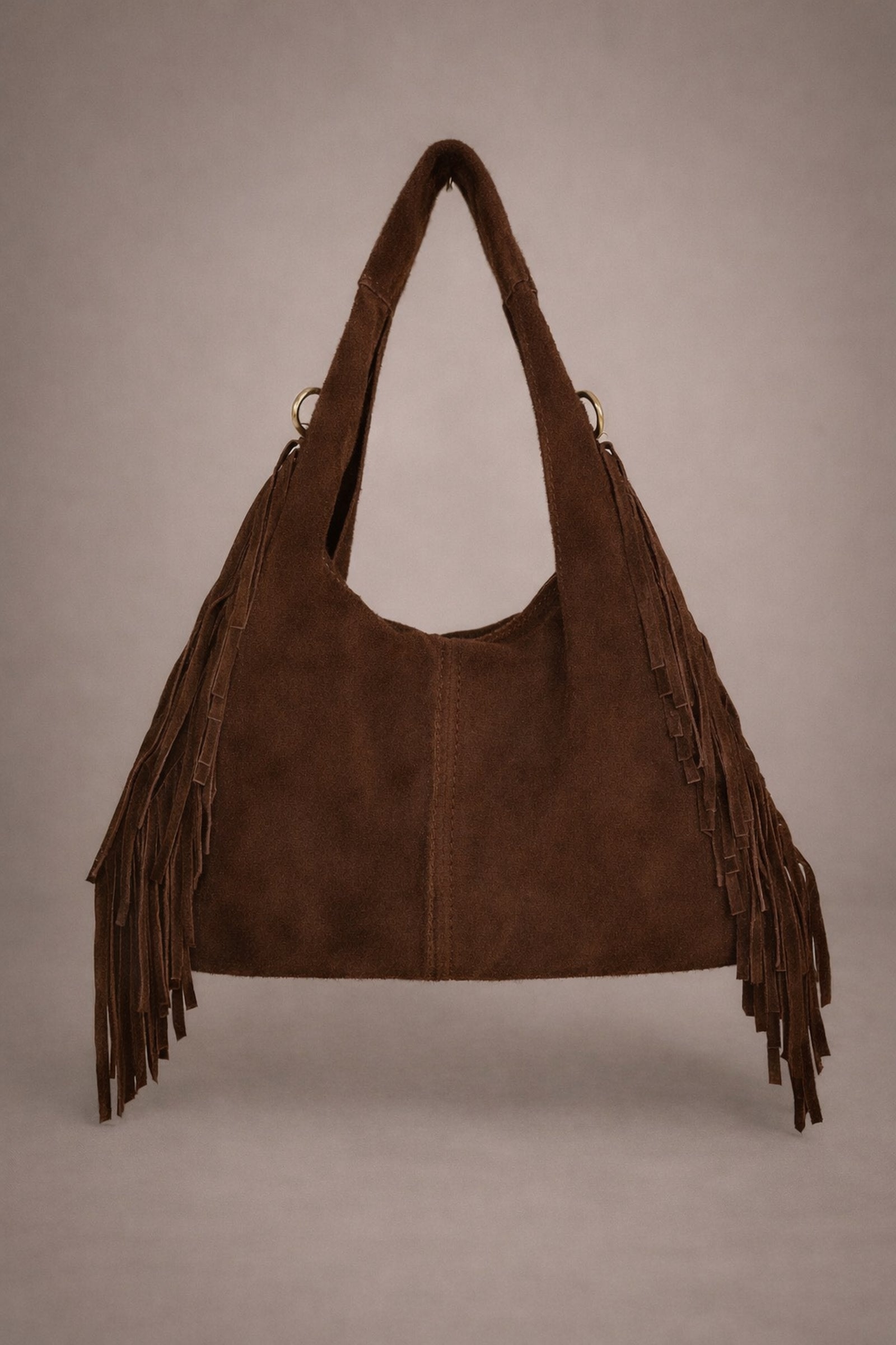 Little Lies Lila chocolate genuine suede fringed grab bag front view in studio setting.