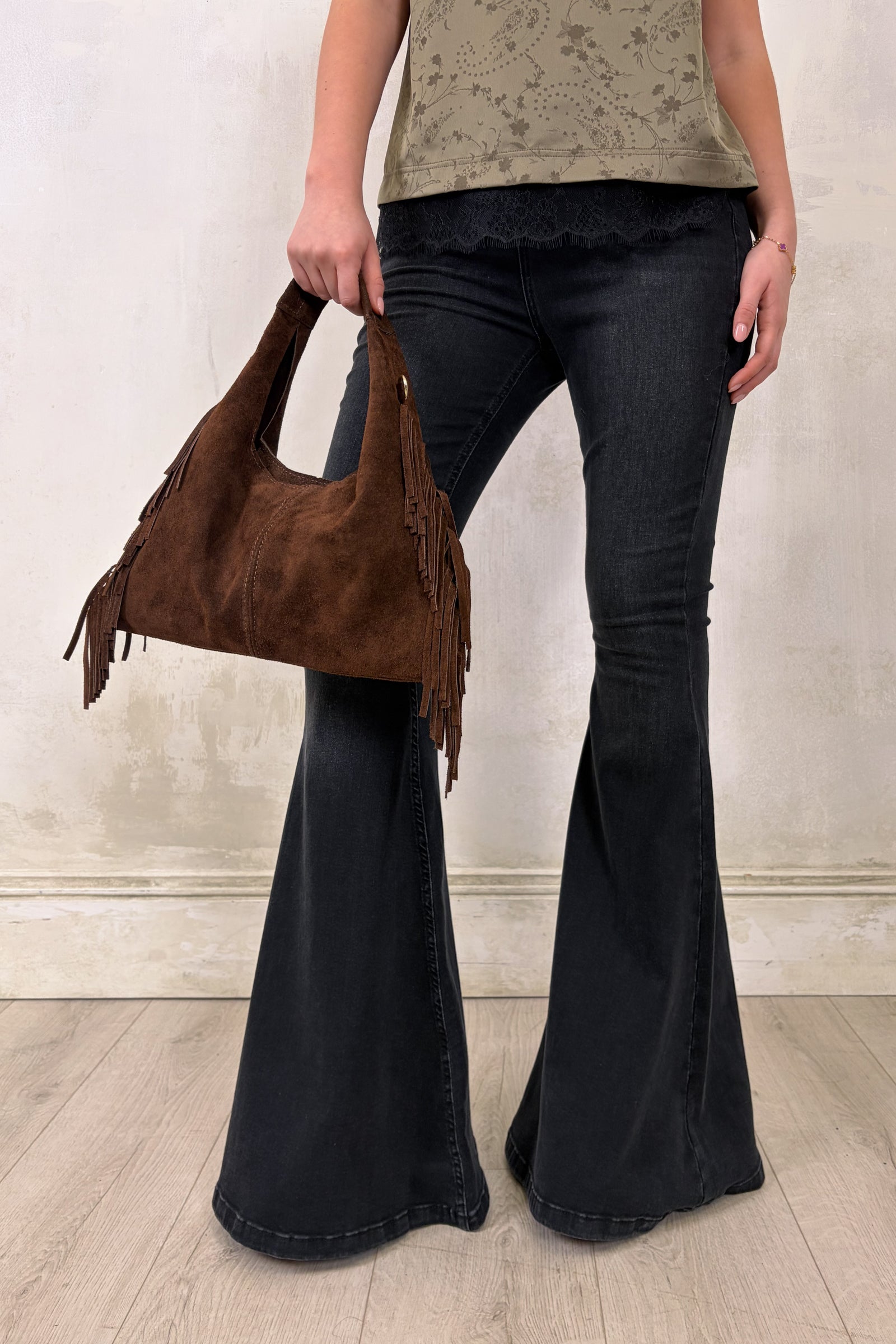 Little Lies Lila chocolate genuine suede fringed grab bag shown in an on‑body styling featuring the Iris Satin Cami and Hendrix Denim Flares, shot in the studio.